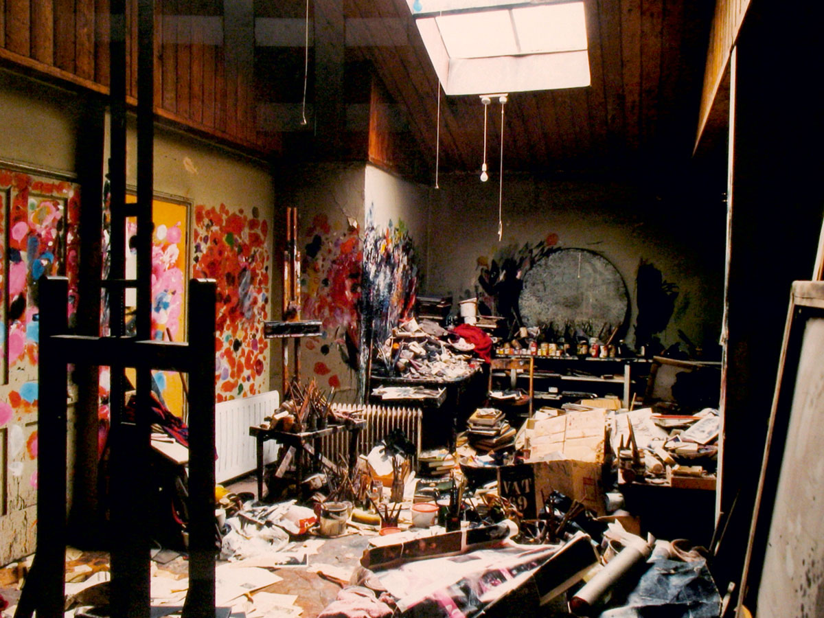 A photograph of Francis Bacon’s studio with mess all around. 