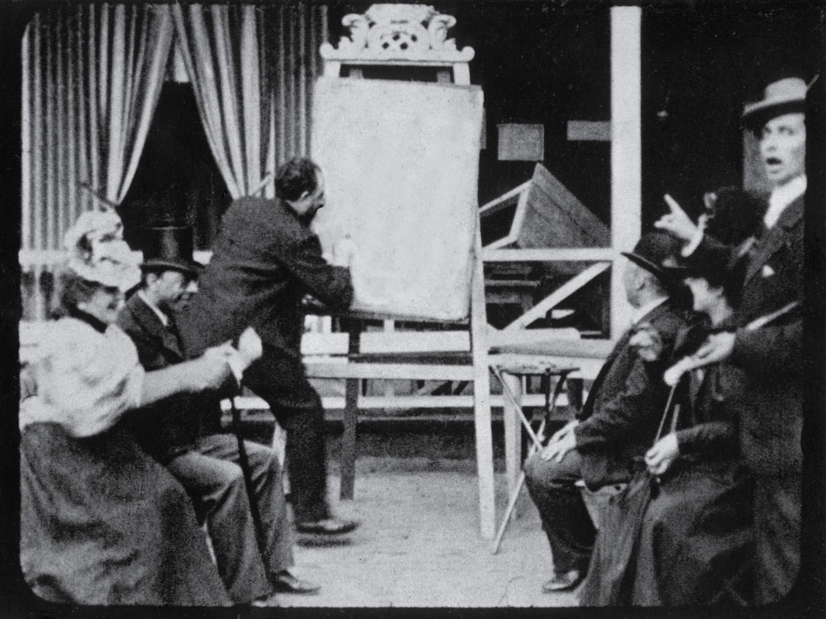 The painter Clixorine in his studio presenting “the color which doesn’t exist” before a shocked public. The only known photograph of the scene, it was probably taken by Simmel himself around 1903. Image and caption “information” provided by Pierre Bismuth.