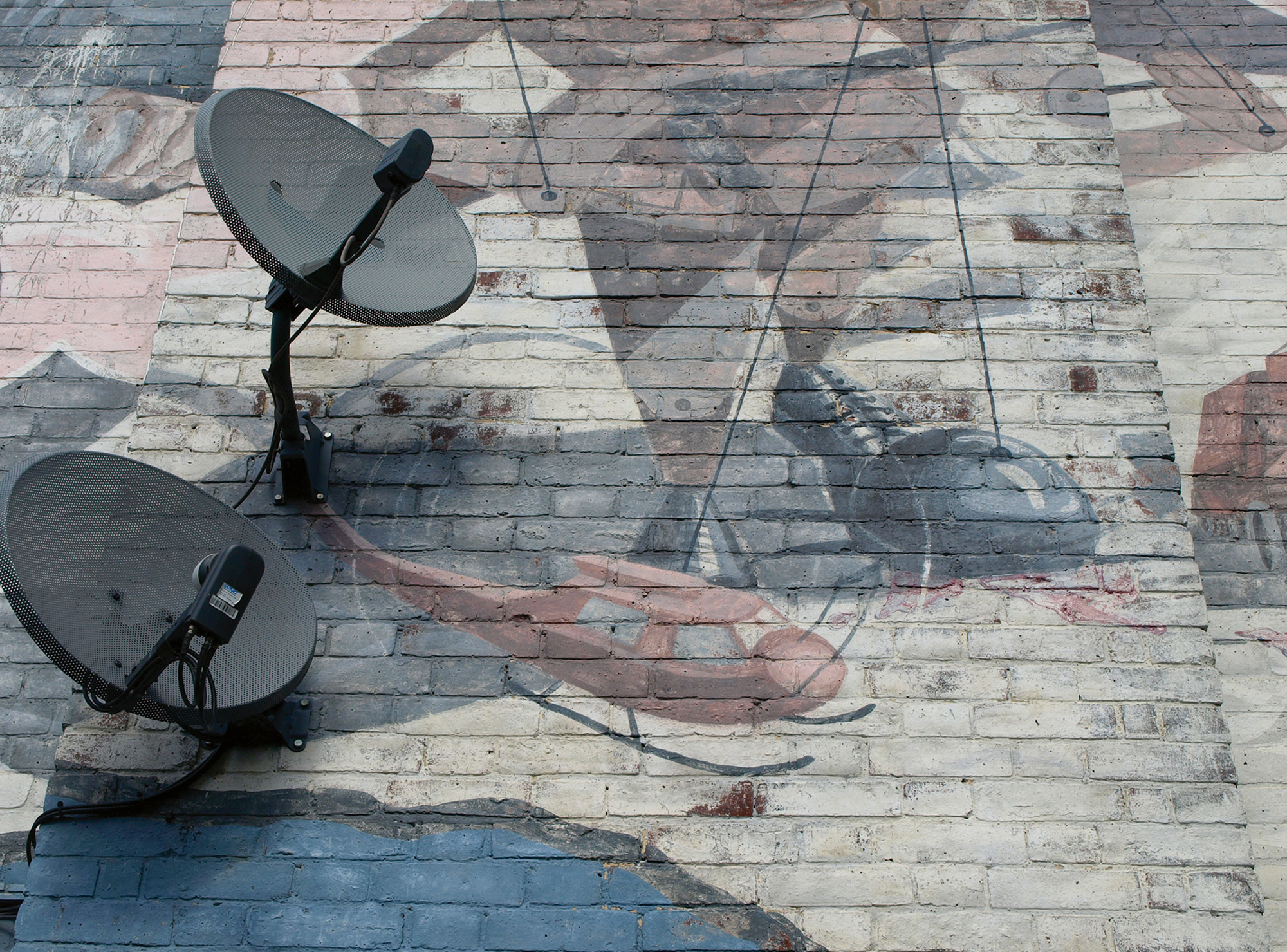 A photograph of a nineteen eighty-five mural by Jane Gifford, Sergio Navarro, Nick Cuttermole, and Rosie Skaife D’Ingerthorpe titled “Changing the Picture.”