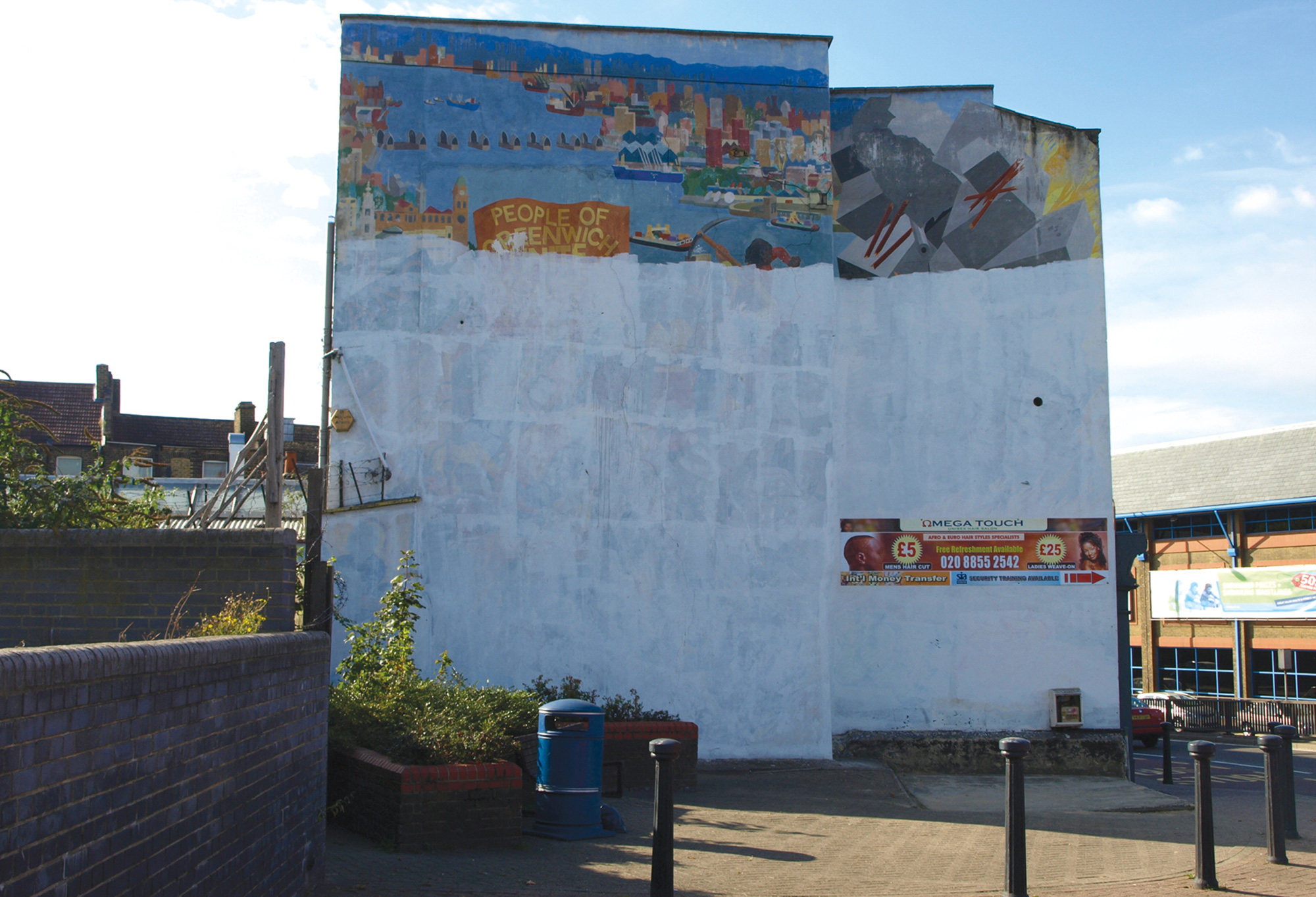 A photograph of an early to mid nineteen eighties mural by the Greenwich Mural Workshop on Woolwich High Street.