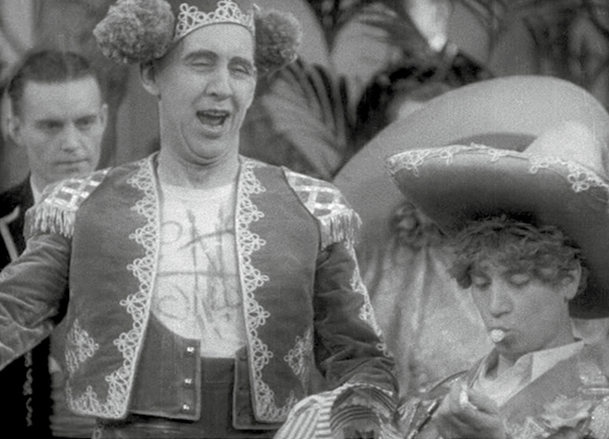 A still from the nineteen twenty nine film “The Cocoanuts” depicting Harpo Marx chewing bubble gum.