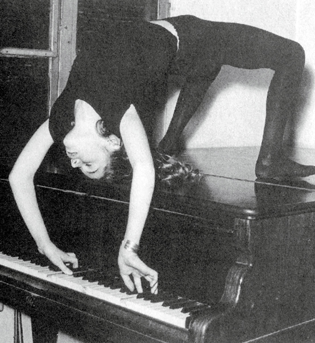 Drouet performing acrobatics while playing a sonata by Mozart, ca. 1960.