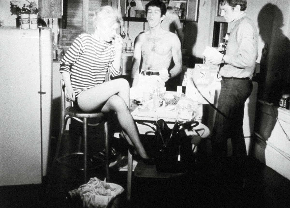 In Andy Warhol’s 1965 film Kitchen, Edie Sedgwick sneezes every time she forgets her lines and needs to look at parts of the script hidden strategically around the set. Still courtesy Andy Warhol Museum.