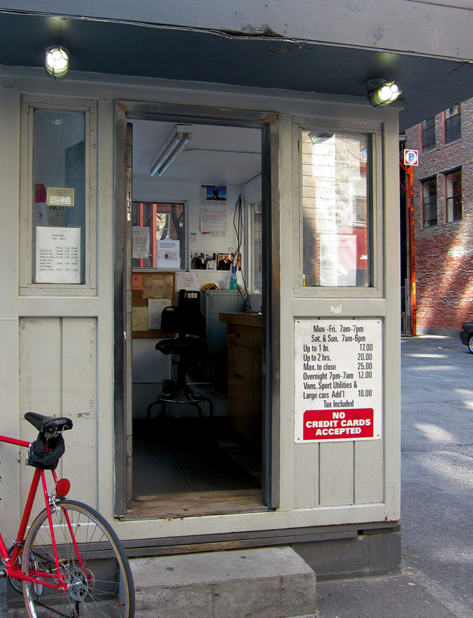 A photograph of a valet booth on twenty-seventh Street, between sixth and seventh Avenues, in New York City.