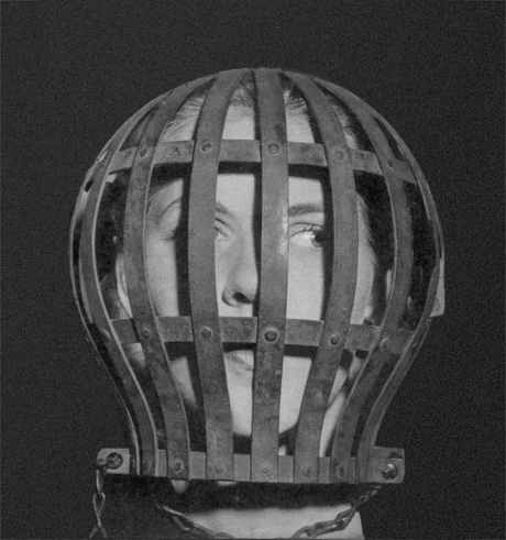 “A photograph of a woman’s head in a cage from a nineteen forty-three issues of “Lilliput” magazine. The device is used to train undergraduates off solids. A knob at the back sets the bars closer and closer together until finally the head is encased by fine mesh and soup is the only food that can pass through.
“