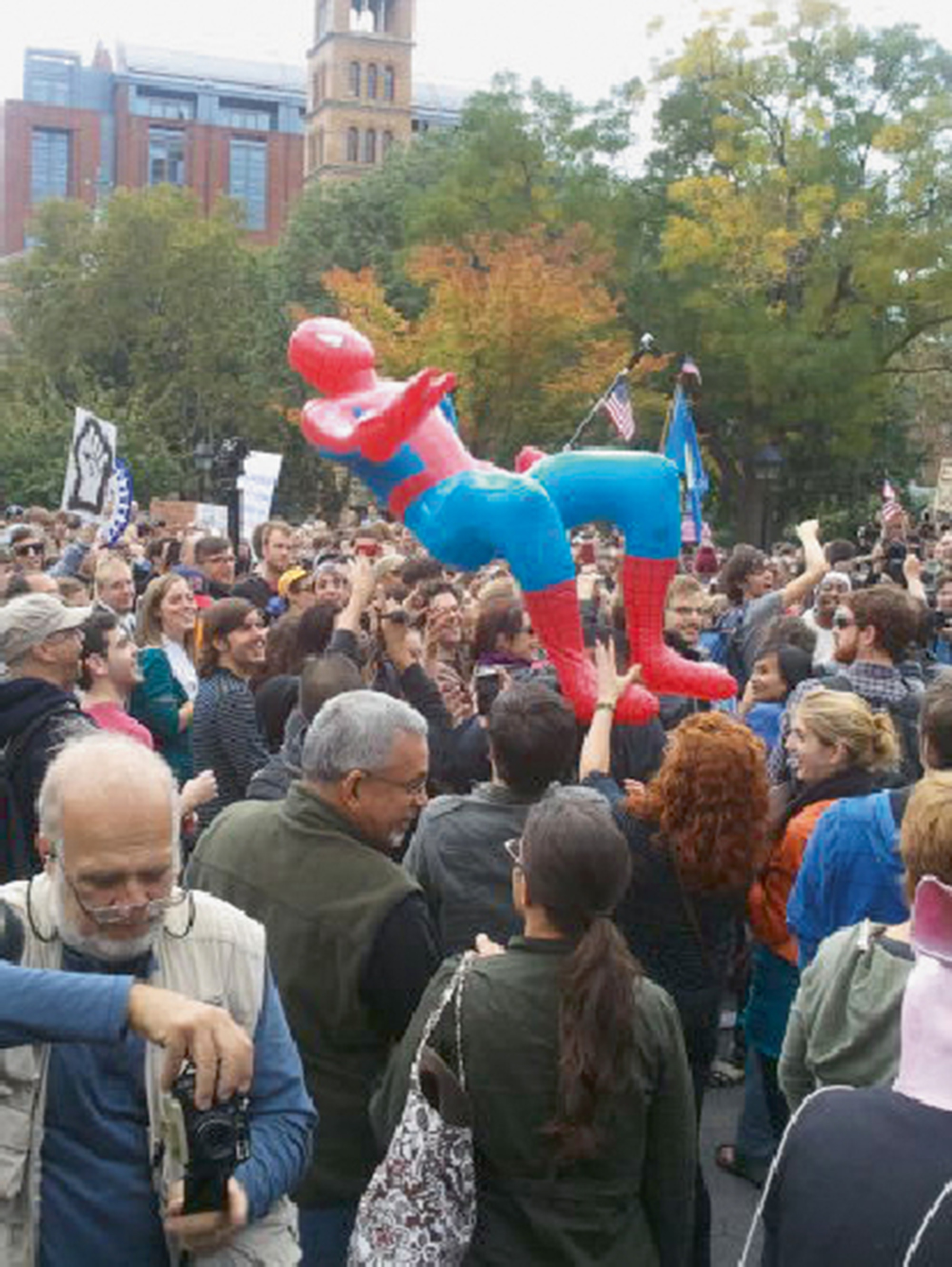 A twenty eleven photograph of an inflatable Spiderman at a protest.