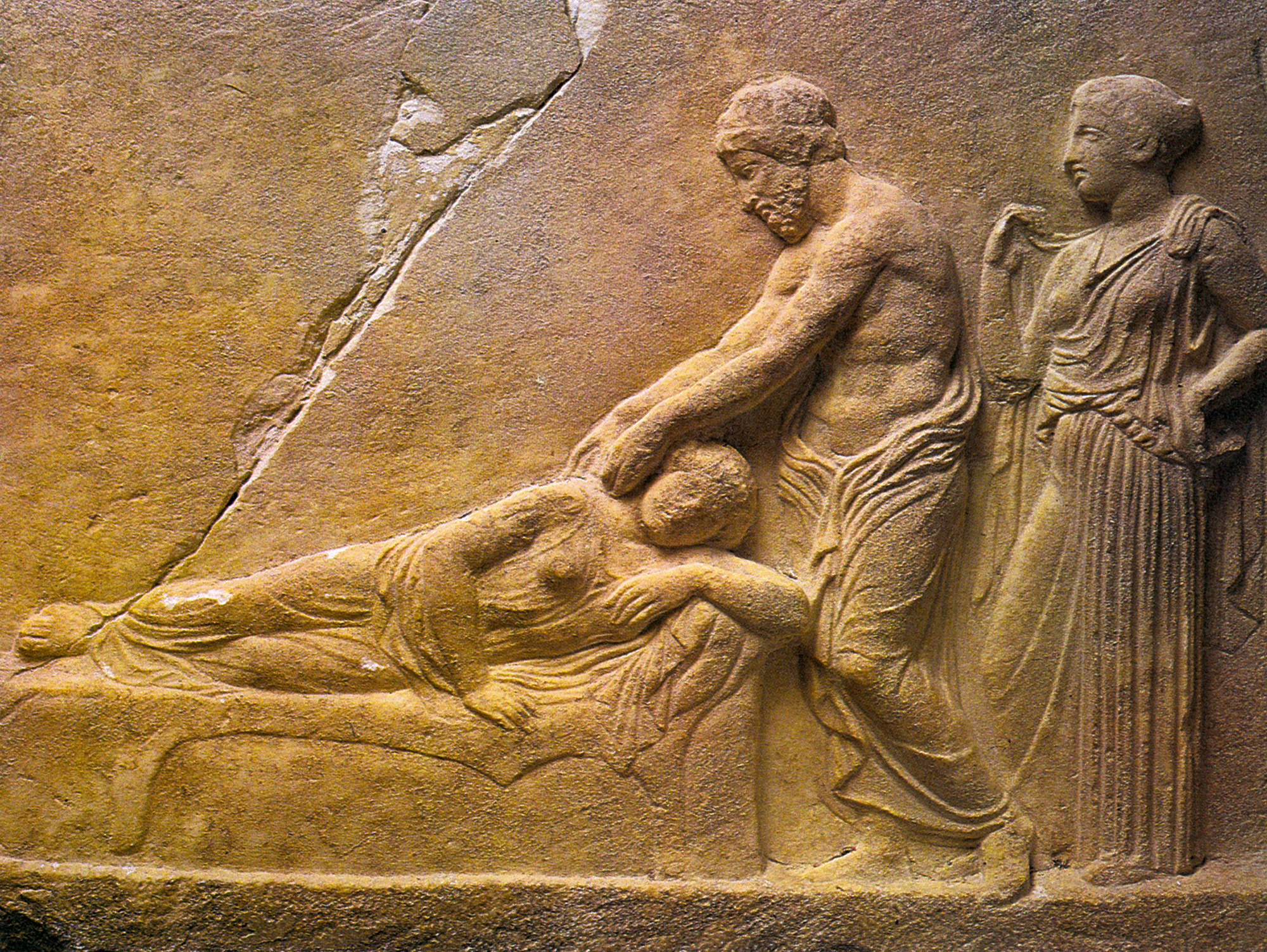 A fourth-century relief votive of Asclepius and Hygieia tending to a sick woman.