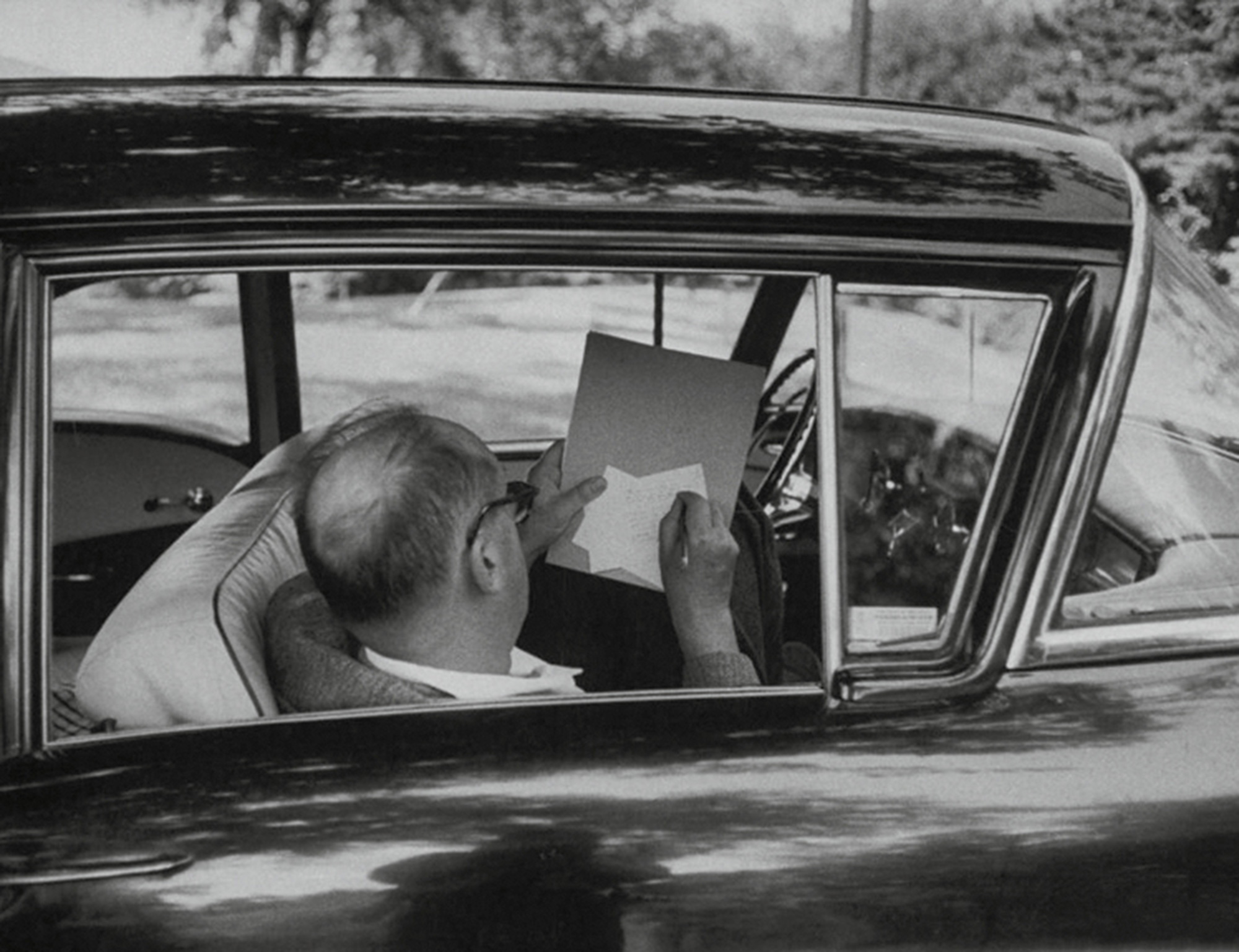 Vladimir Nabokov scribbling on note cards.