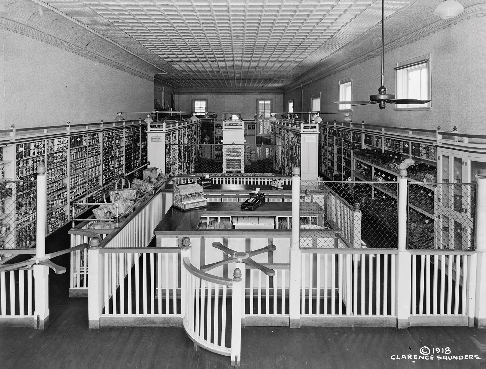 The front of the postcard for this issue, featuring a photograph of a shop interior. 