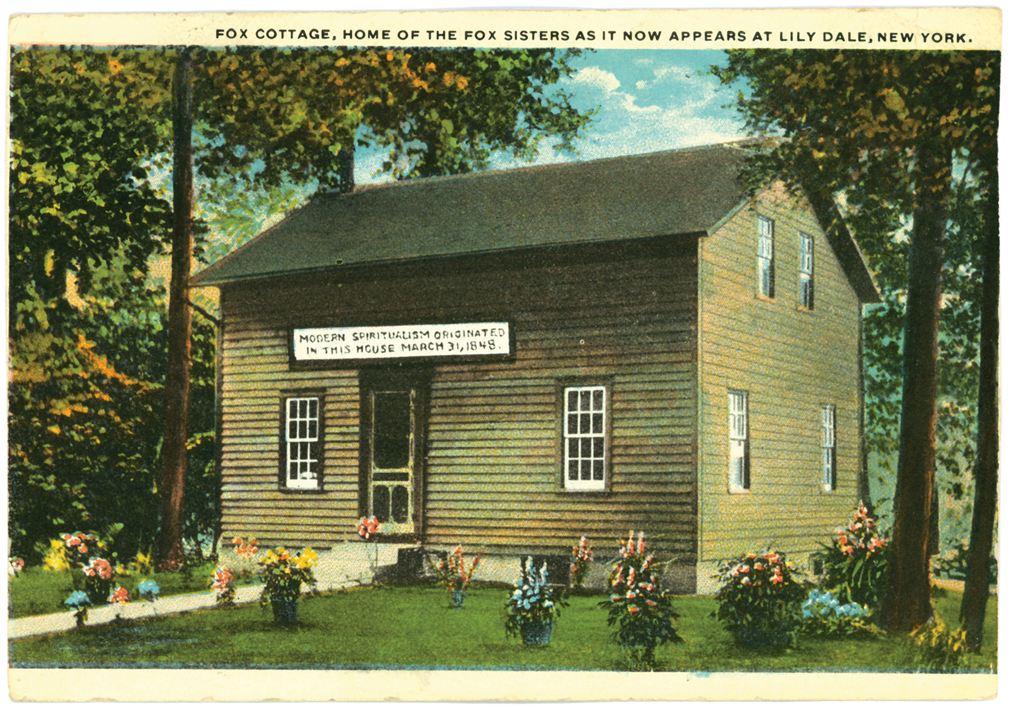 A postcard (postmarked 1 August nineteen twenty-two) depicting the Fox sisters’ cottage after it had been relocated to Lily Dale, New York, in nineteen sixteen.