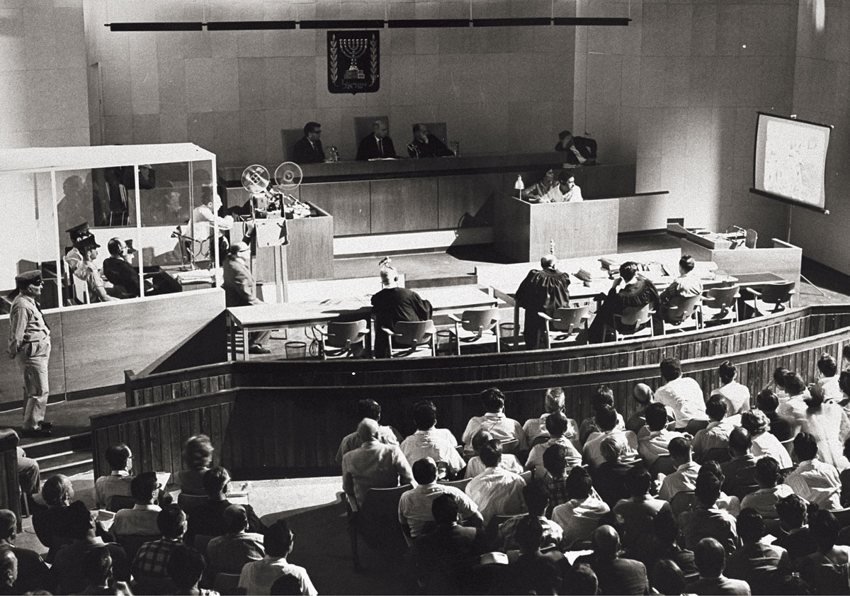 A photograph of the court watching a film during the trial.
