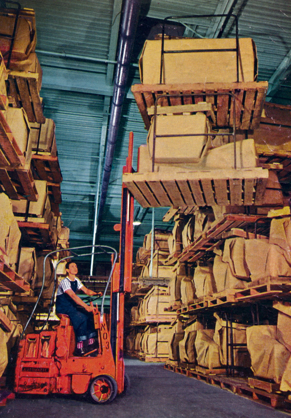 Having proven their worth in the war effort, pallets became a staple of postwar industry. A forklift operator moves goods at a Salt Lake City warehouse.