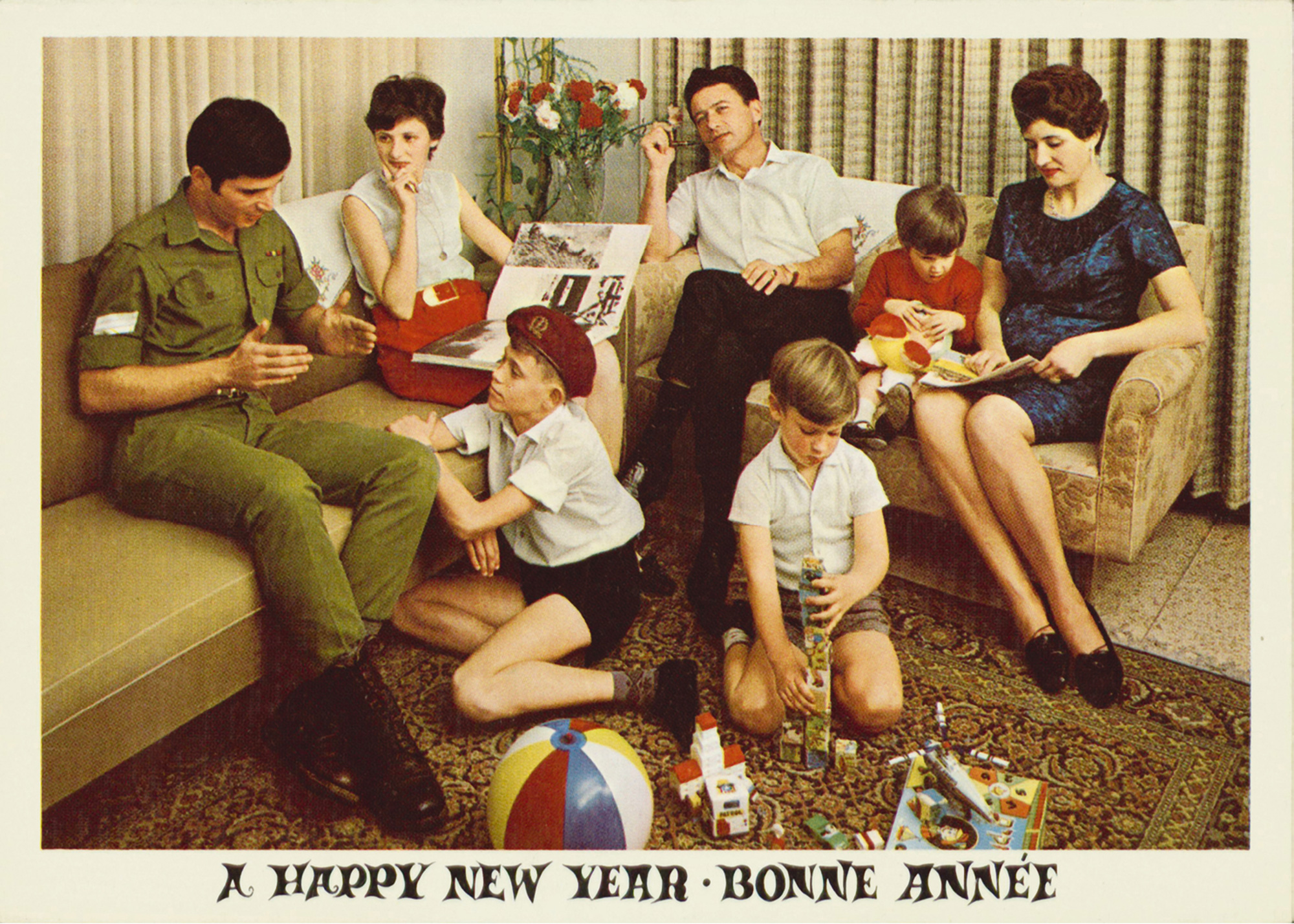 A circa nineteen sixty-eight to nineteen seventy Shana Tova card depicting a soldier at home surrounded by his family.