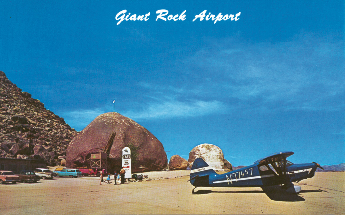 A meeting place for flying objects, identified and unidentified. Undated postcard of Giant Rock during the Van Tassel family’s occupancy of the site. The café sign features an image of a UFO.