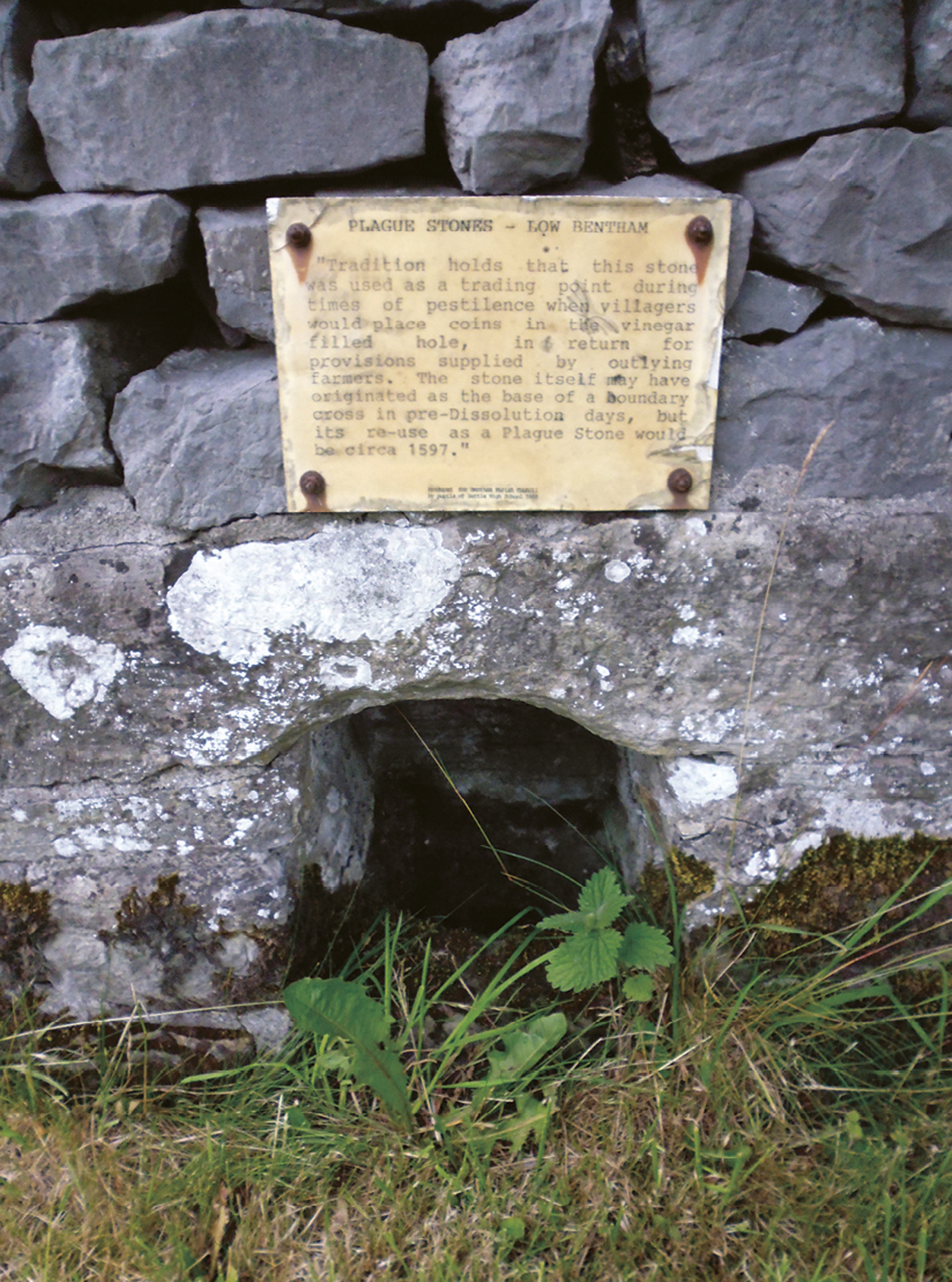 Artist Sophie Nys’s photograph of a plague stone which is commemorated by a plaque at Low Bentham, North Yorkshire.
