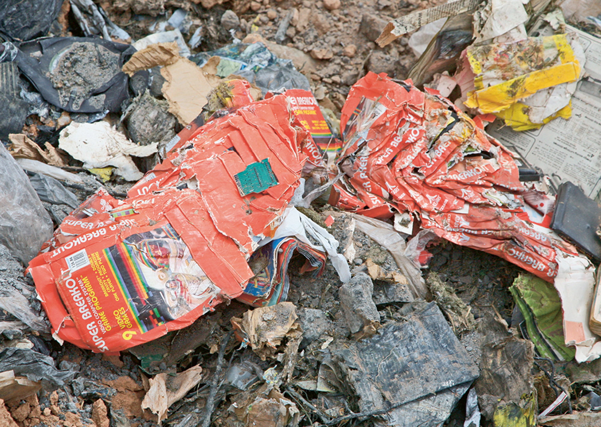 A photograph of discarded merchandise at the Atari Incorporated landfill site in Alamogordo, New Mexico.