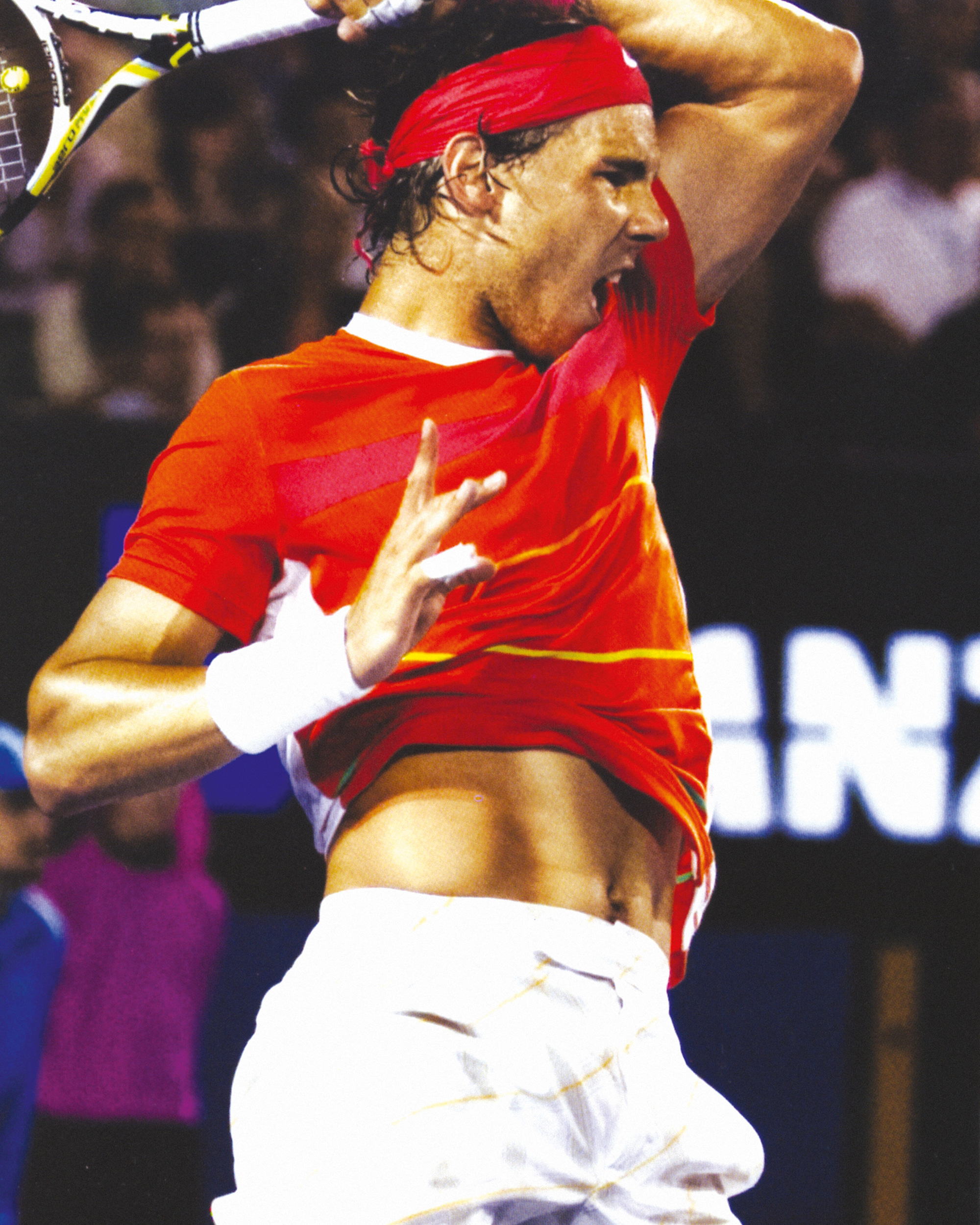 A photograph of Nadal unleashing his bullwhip forehand at the two thousand and ten Australian Open.