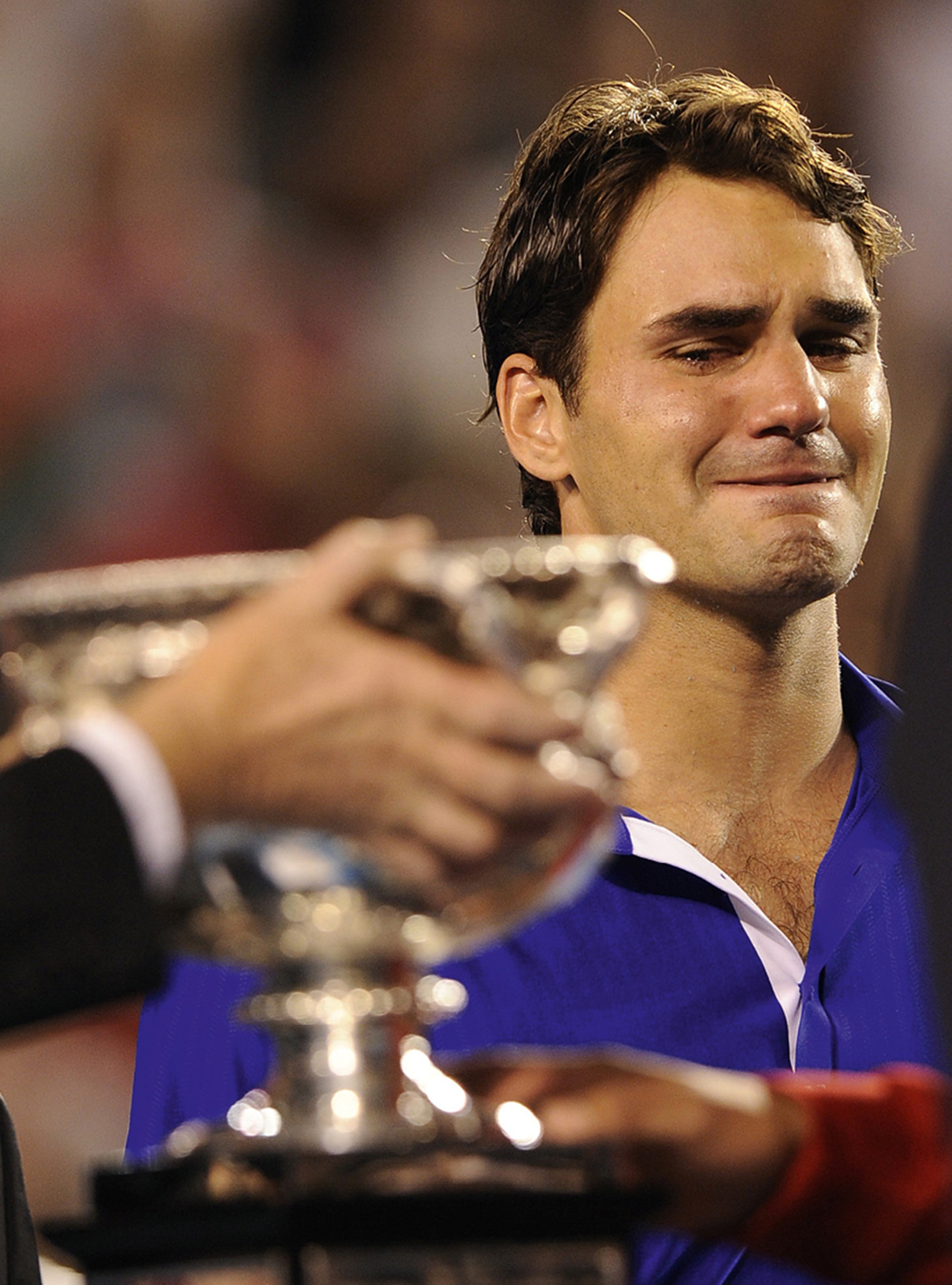 A photograph of Federer breaking down after losing the two thousand and nine Australian Open final to Nadal.