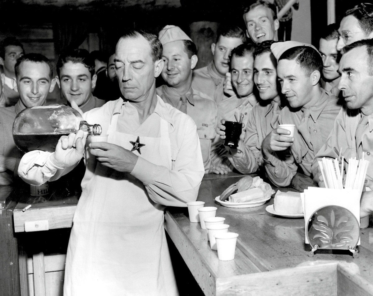 A circa nineteen forty-four photograph of Keaton plying servicemen with drinks at the Hollywood Canteen.
