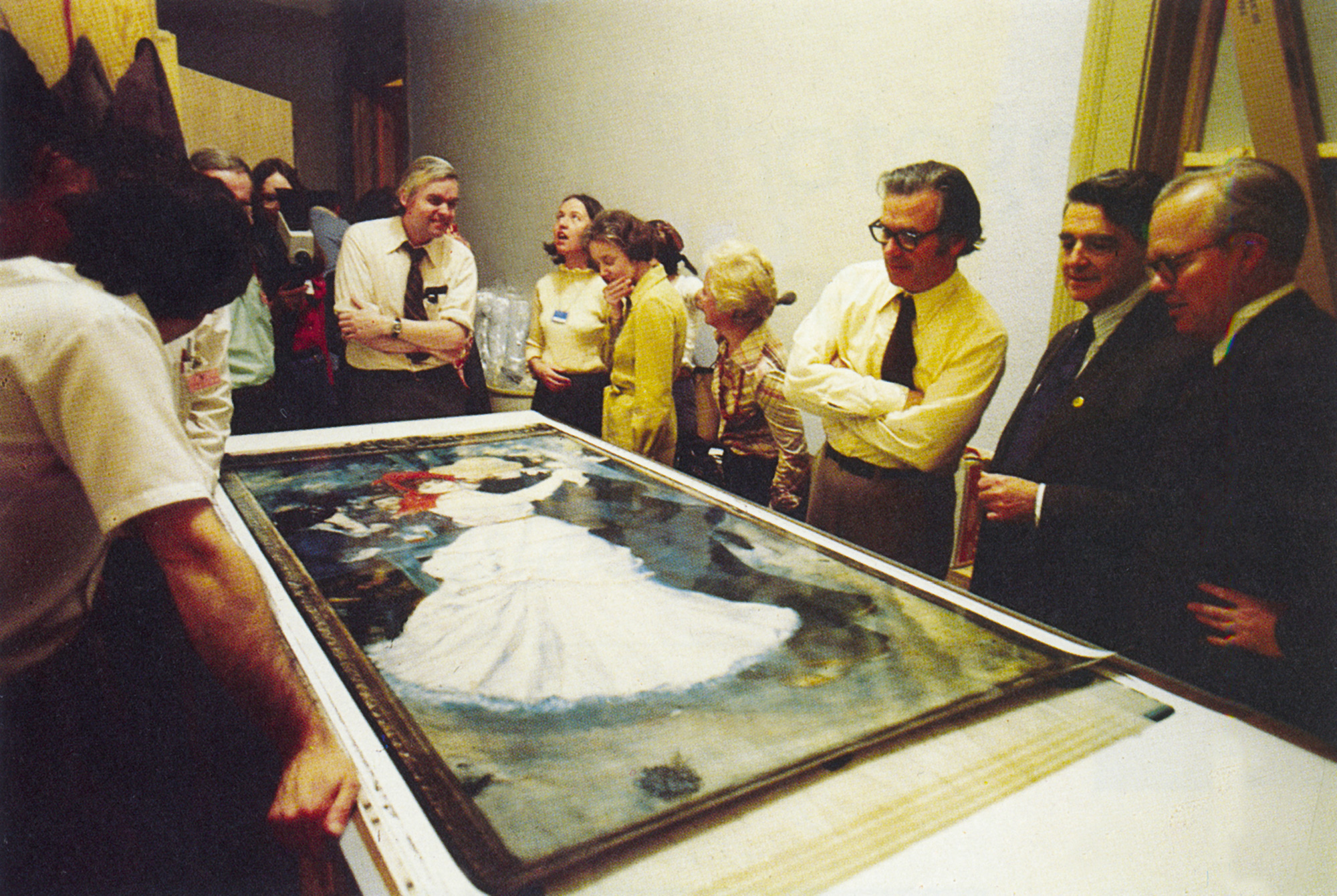 Examining a full-size photograph of a Renoir painting, Museum of Fine Arts, Boston, 1976. This was the first photographic replica of an artwork made using Polaroid’s room-sized “Camera Camera.”