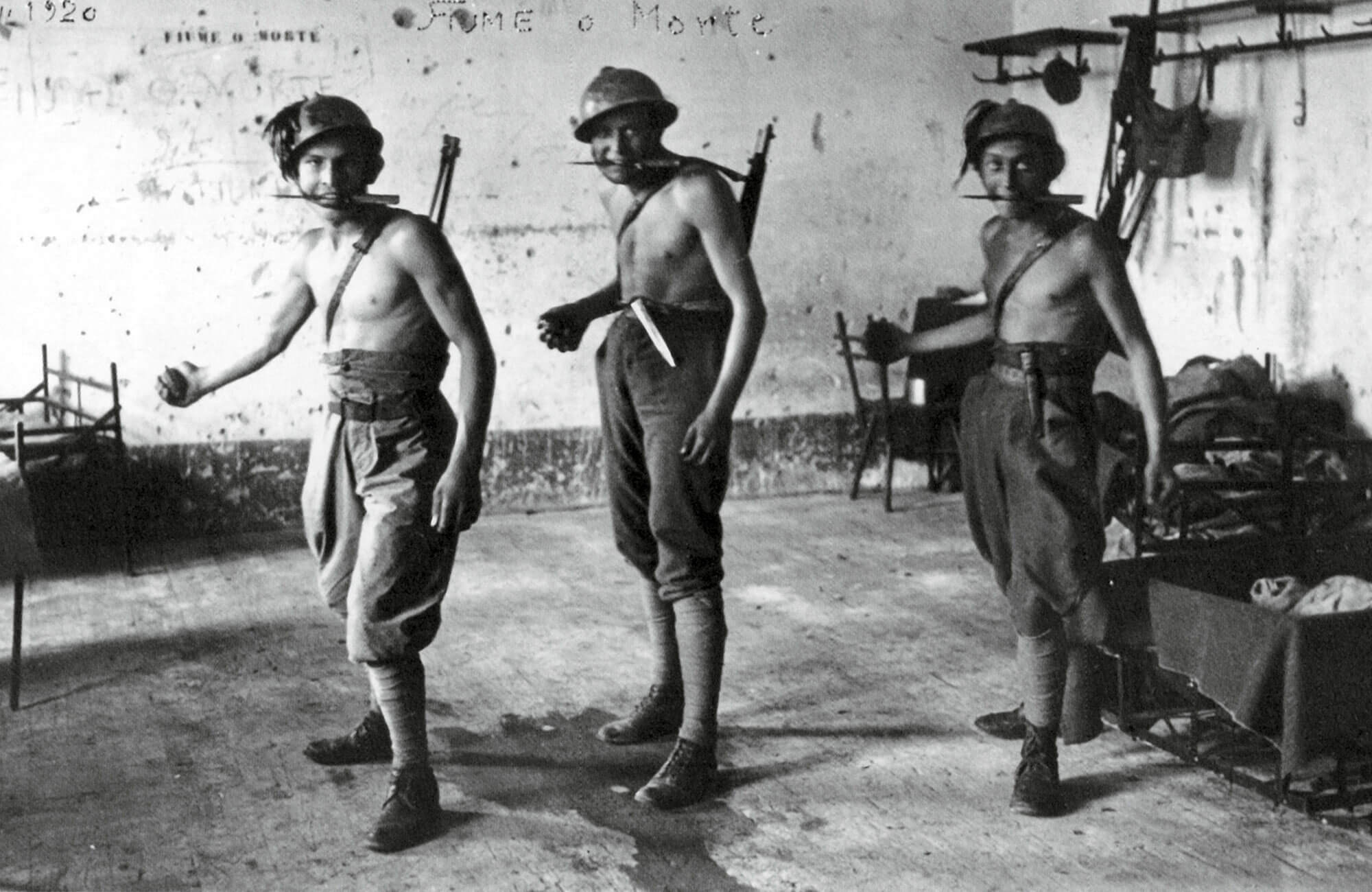 Three Fiumean arditi brandishing their weapons of choice, August 1920.