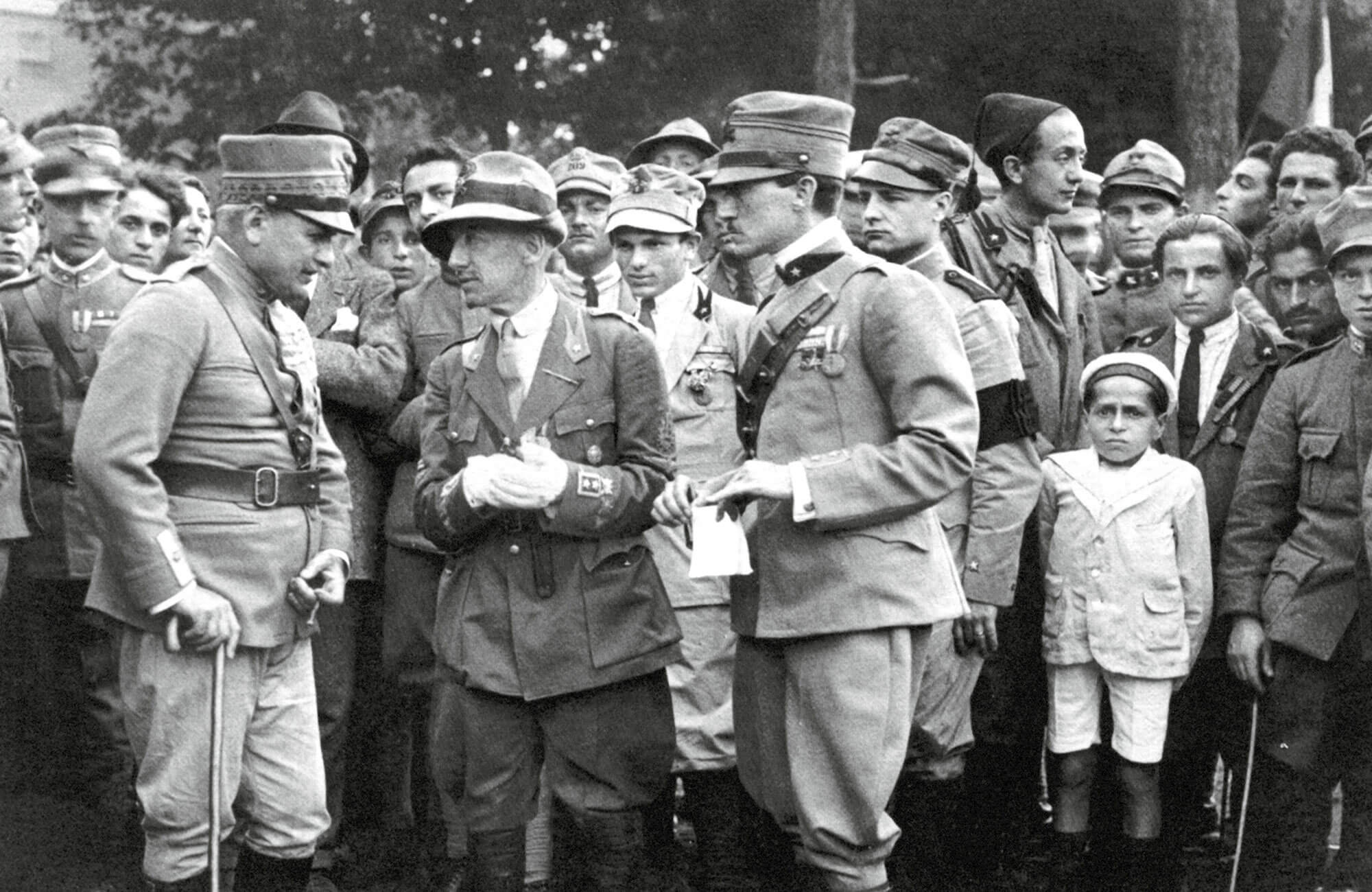 D’Annunzio conferring with two of his military commanders, 30 May 1920.
