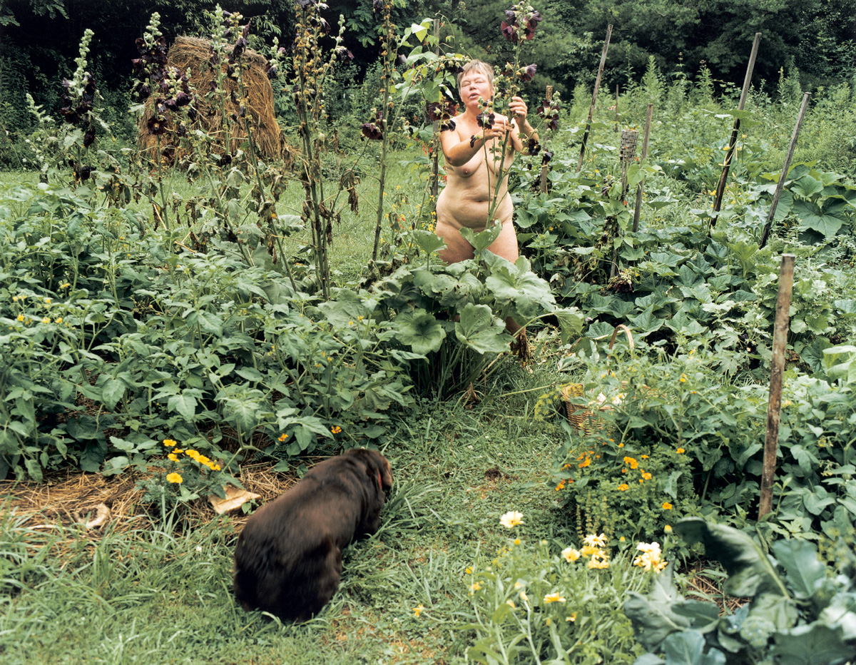 A 2001 photograph by artist Justine Kurland entitled “Hollyhocks” depicting nude women gardening. 