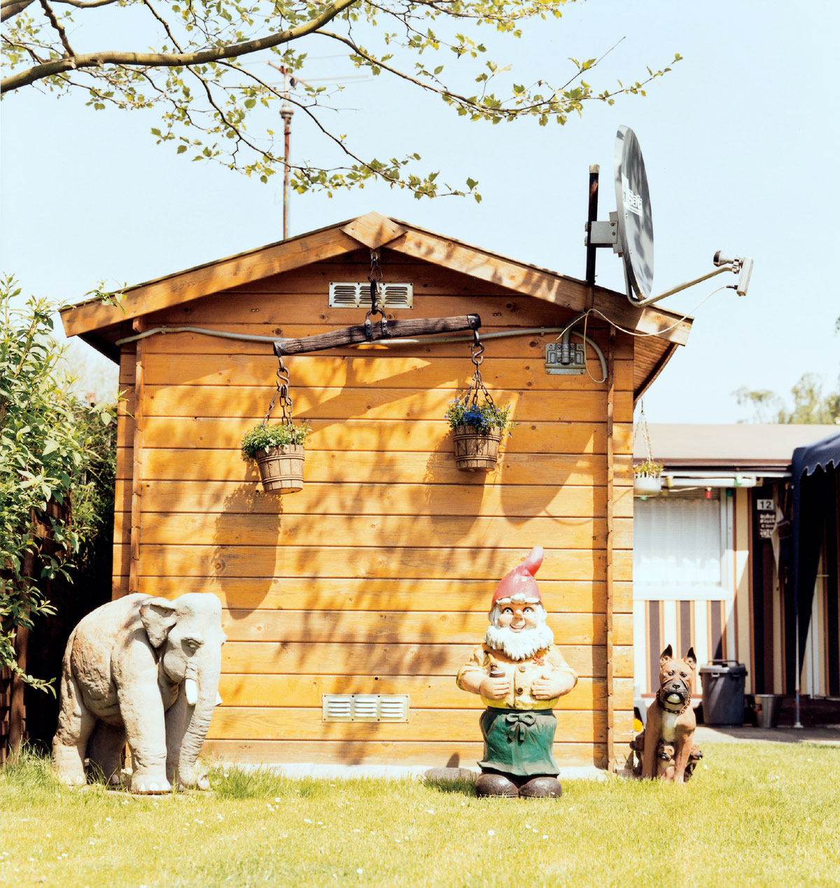 A photograph by artist Enver Hirsch of the decorations in a Schreber garden in Germany.