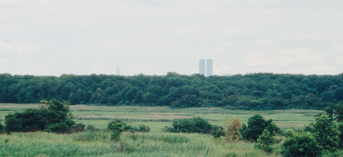 A photograph by artist Mierle Laderman Ukeles of the Manhattan skyline seen from top of Fresh Kills Landfill.