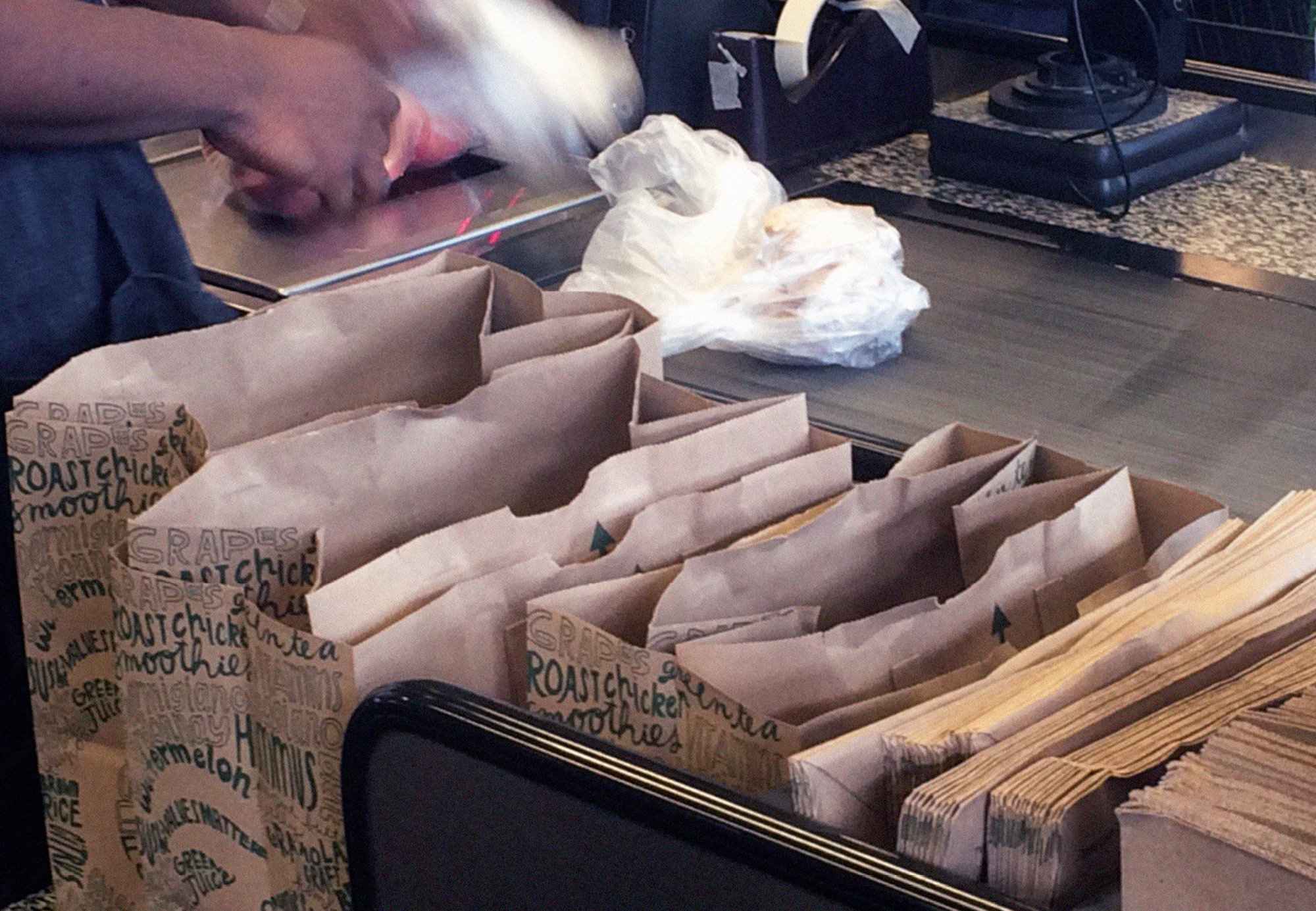 A photograph of a grocery bagging station.