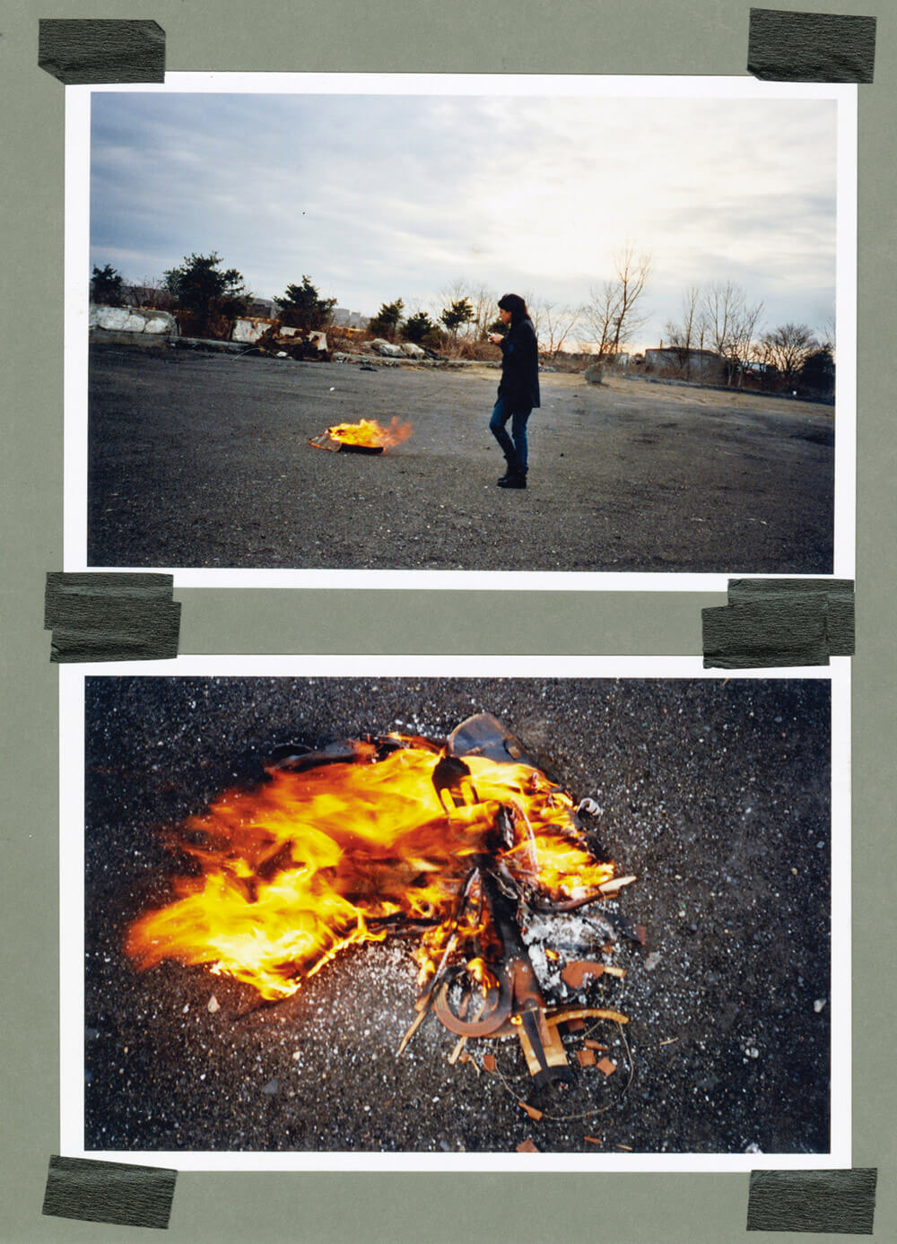 A photograph of two photographs taped to a wall. One is a photograph of a woman standing next to a fire, the other a close-up shot of the fire.