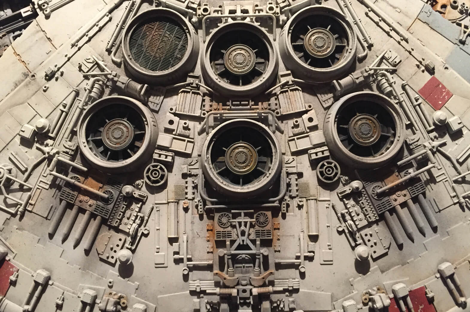 A close-up shot of the Millennium Falcon showing the intricate analogue greebling of its exterior. The designers of the “Star Wars” spaceship employed a number of repurposed elements from World War Two tank and aircraft model kits to achieve the effect.