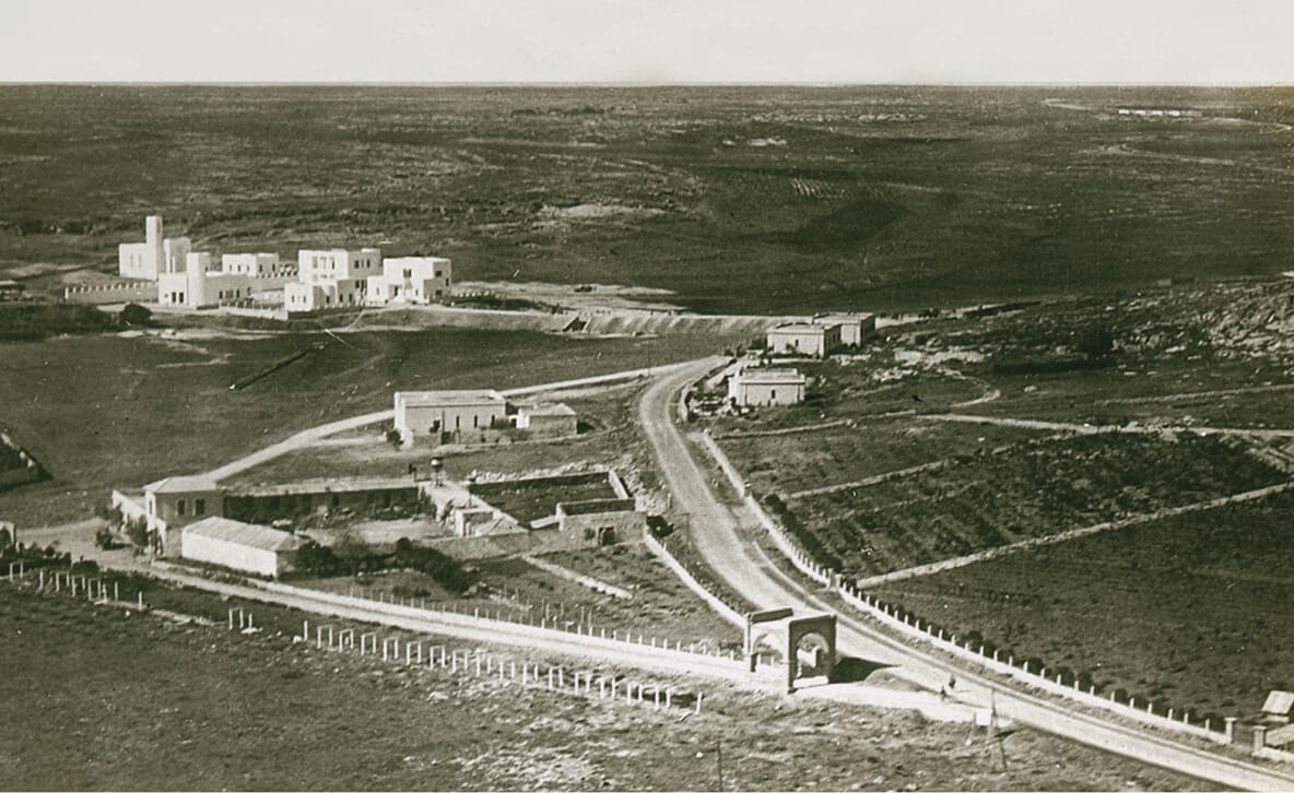 An undated photograph of an Italian agricultural village being constructed in the Libyan Desert.