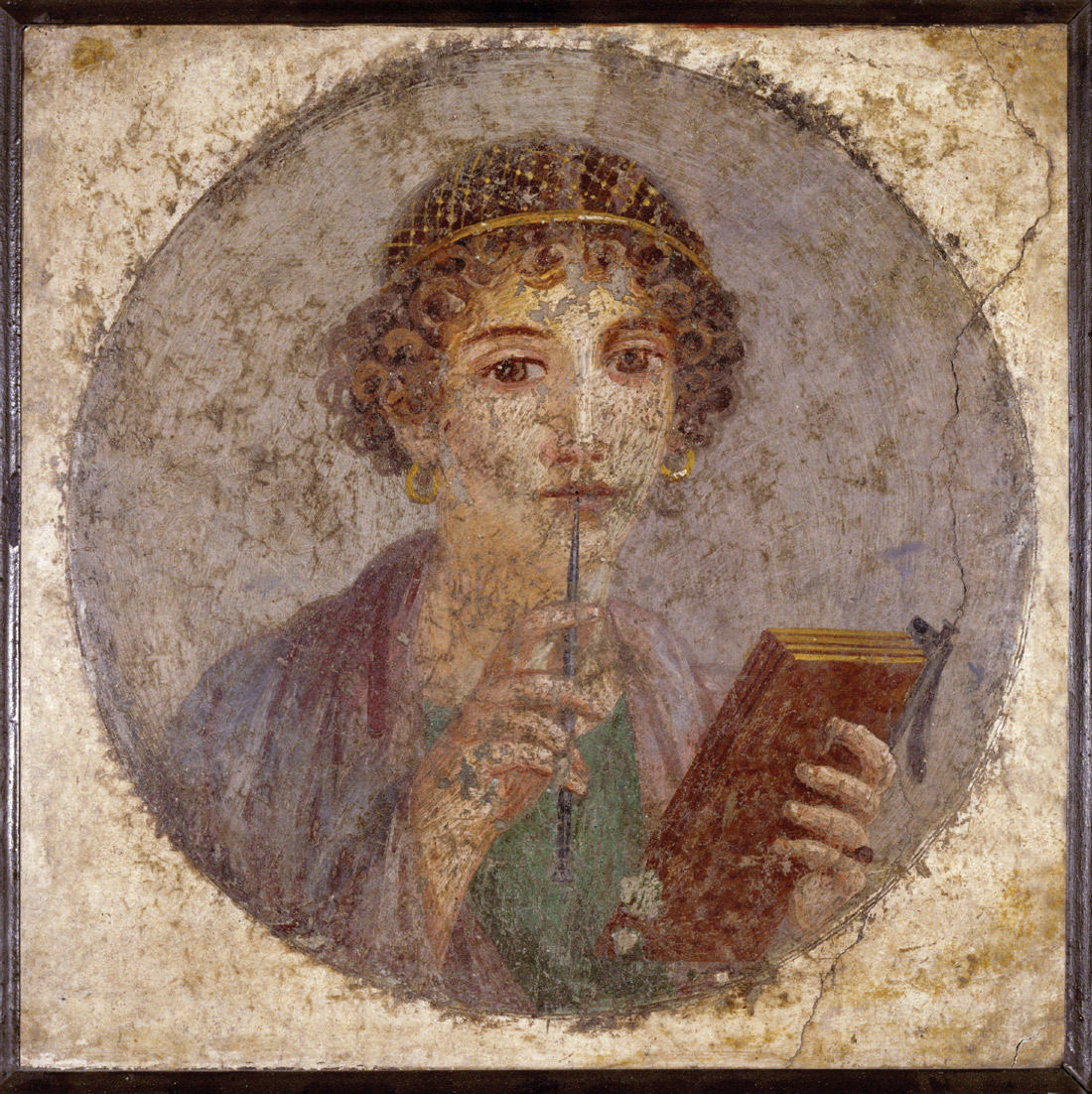 A photograph of a Pompeii fresco, circa fifty AD, depicting a woman holding a set of wax tablets and a stylus.