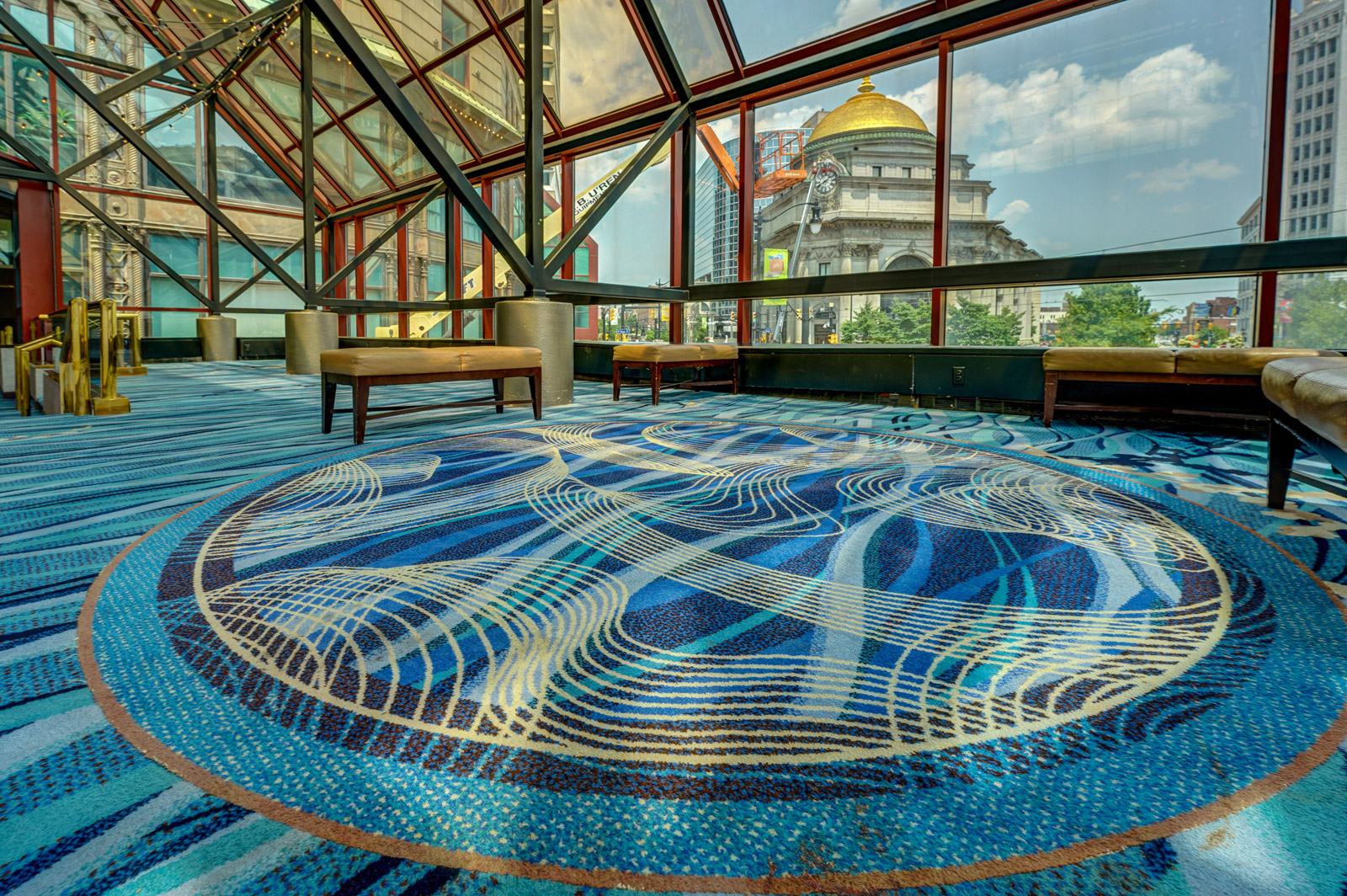 A photographer of the atrium of the Hyatt Regency Buffalo, whose carpet intrigued the author and led him to explore the history of such designs.