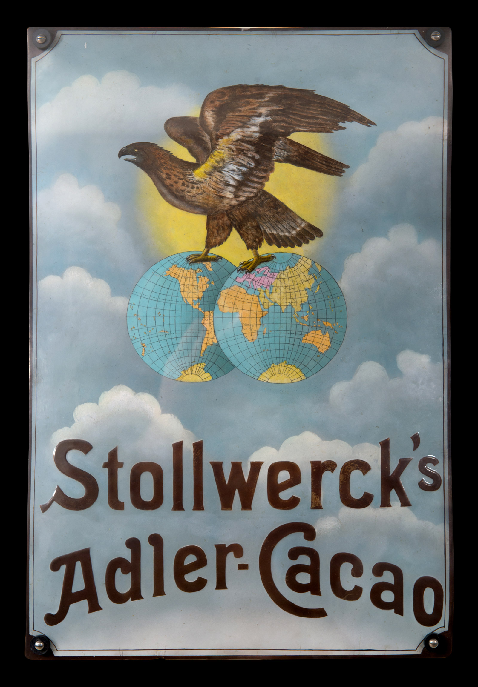 A photograph showing an enamel sign used in 1903 by the Stollwerck chocolate company.