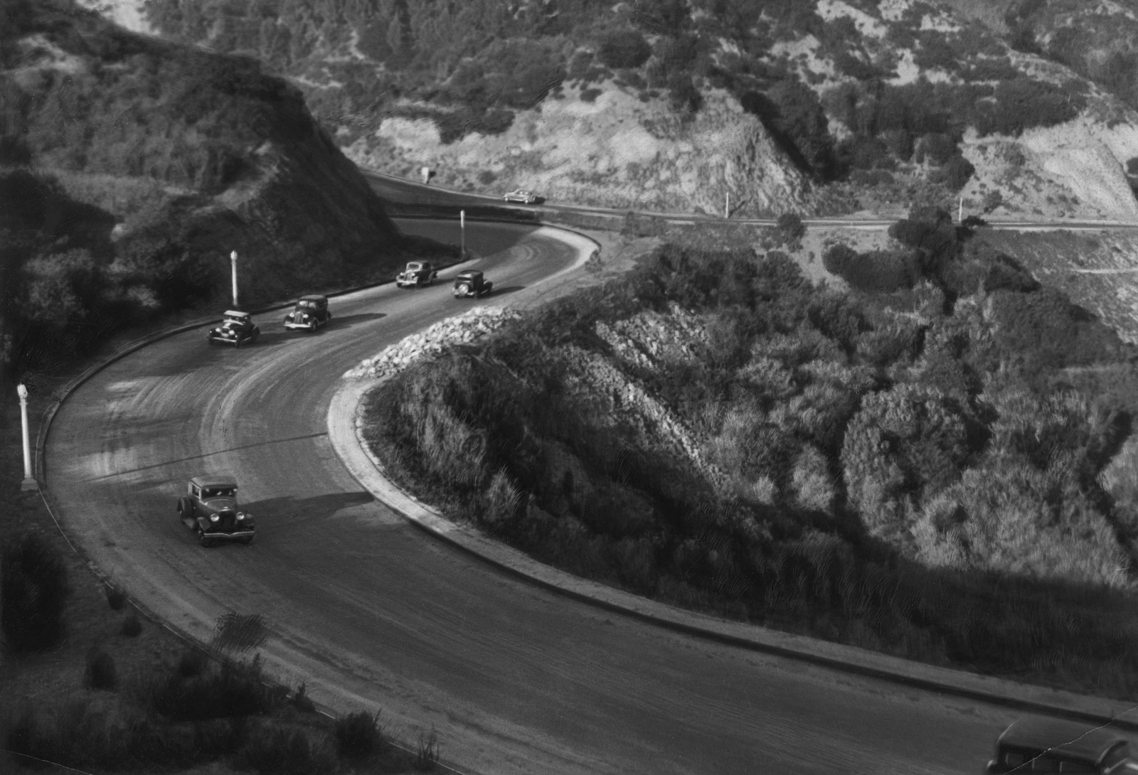 Photograph by Ilf of a serpentine road with cars, circa nineteen thirty-five.