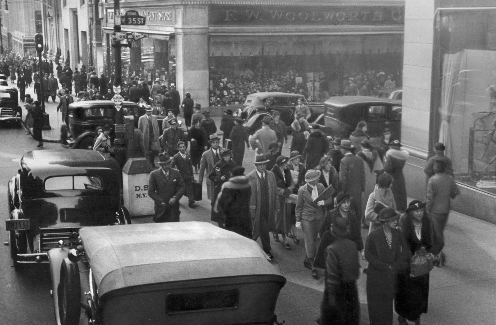 Photograph by Ilf of a crowd on a city street, circa nineteen thirty-five.