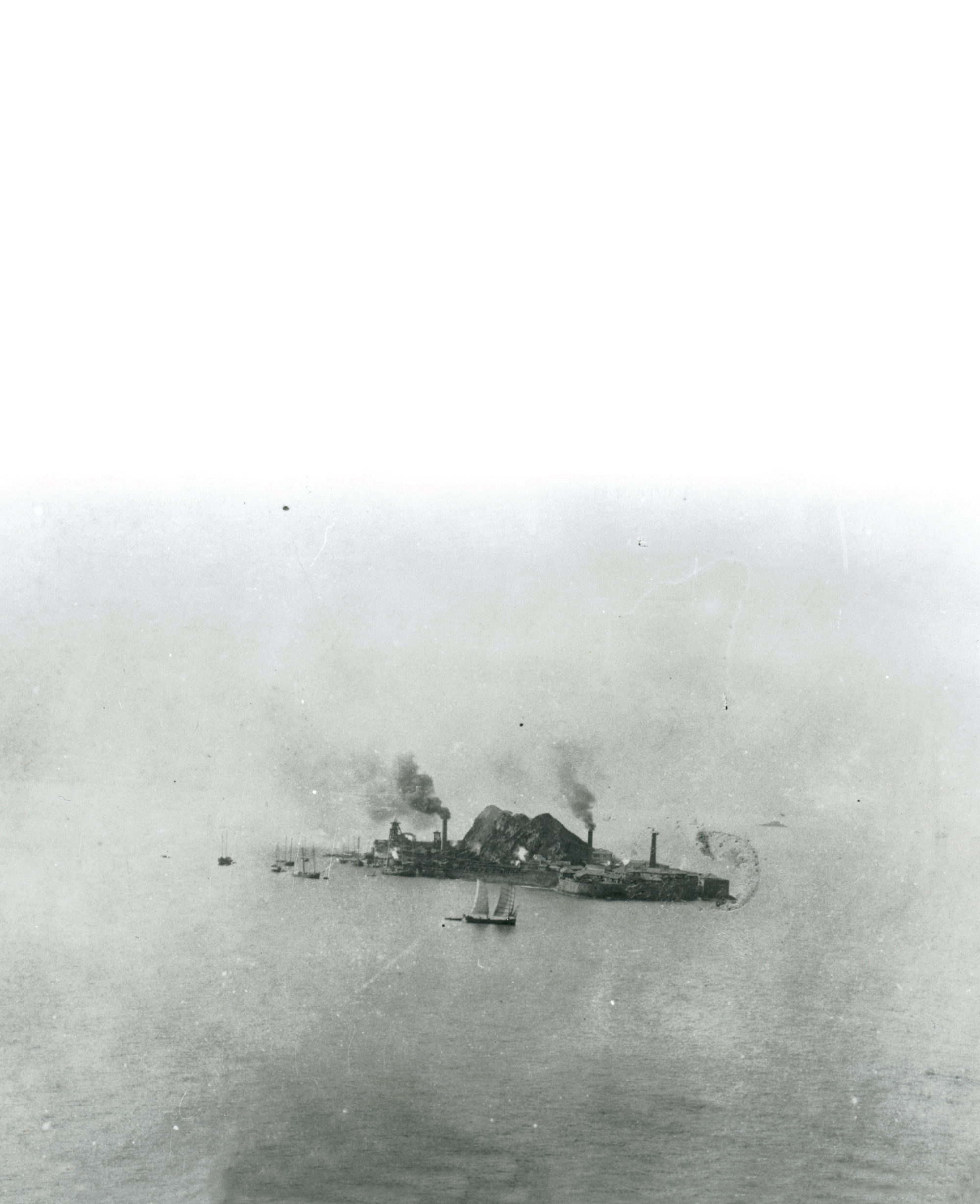 A photograph of Hashima in the late nineteenth century, prior to the major reclamations from the sea.