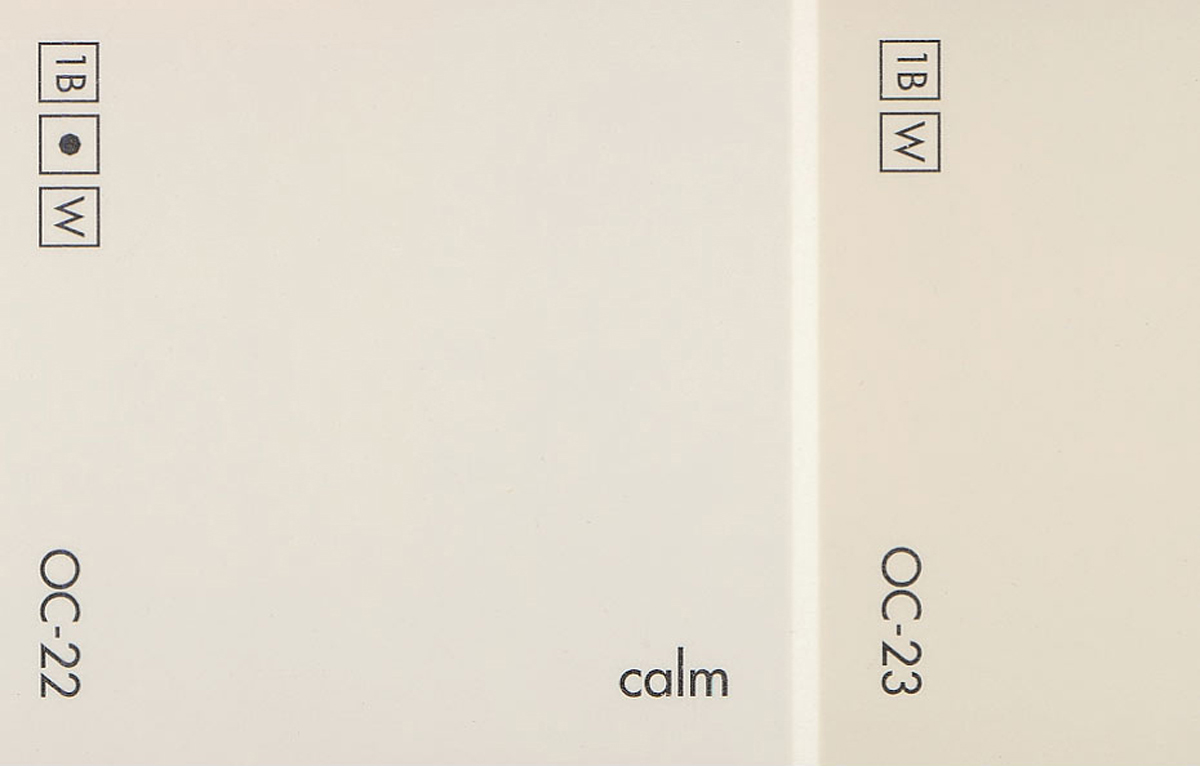 A detail of a paint chip showing the Benjamin Moore paint color OC-22 “Calm.”