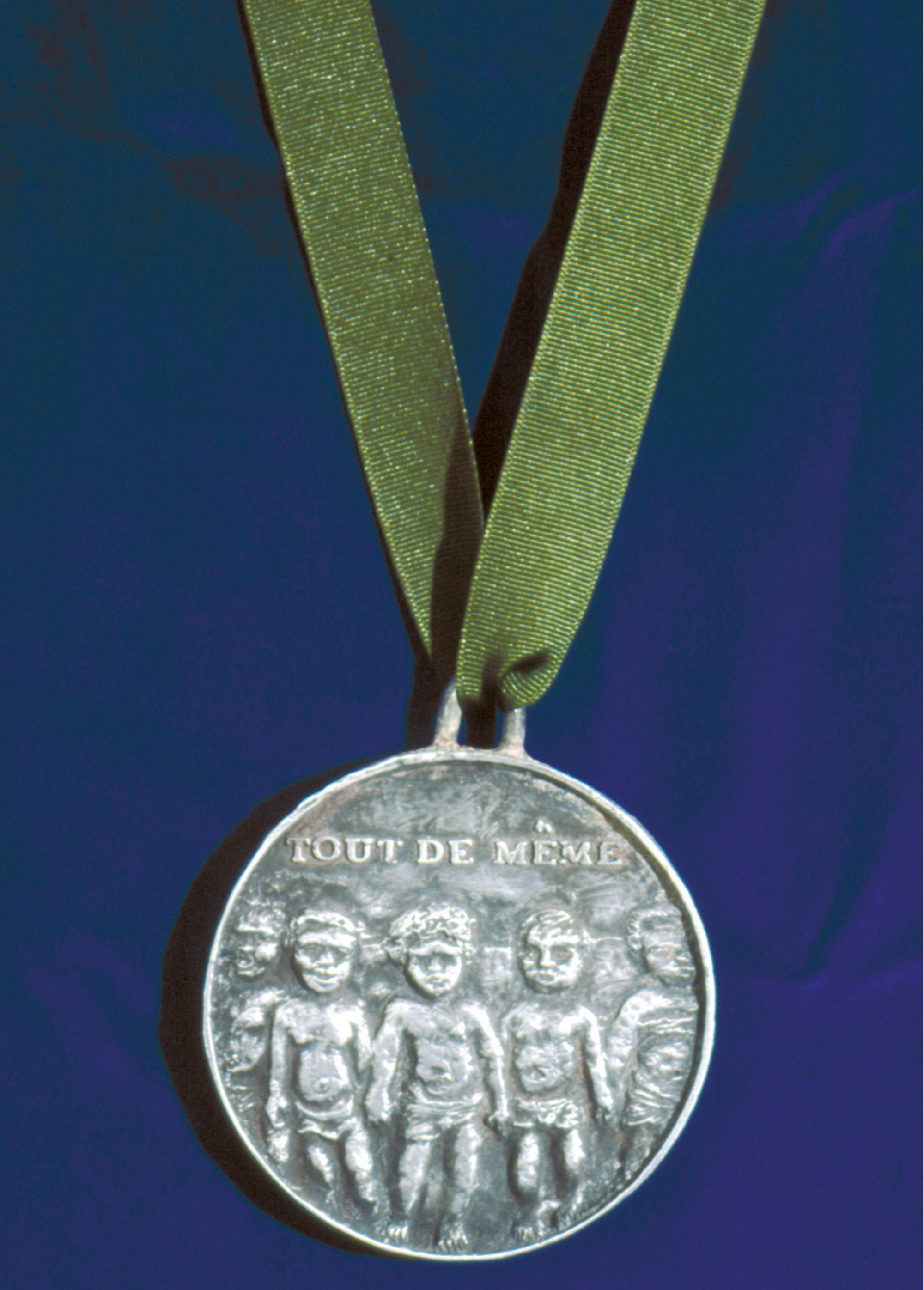 A photograph of the front of Kris Lee's reproduction of the 1976 Montreal Olympic participation medal.