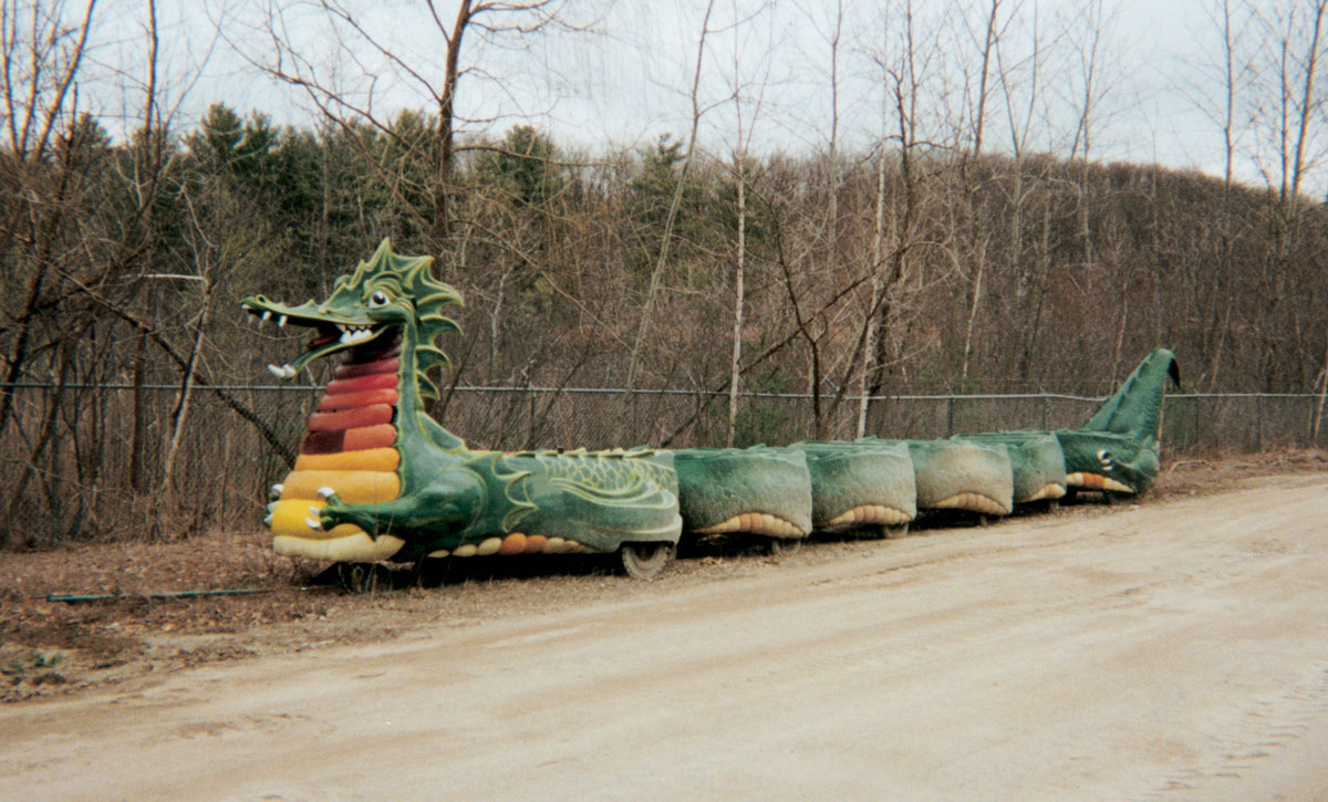 A photograph of Danny the Dragon retired behind the maintenance yard at the Great Escape.