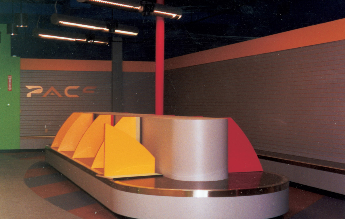 A photograph of the empty interior of an abandoned travel agency.