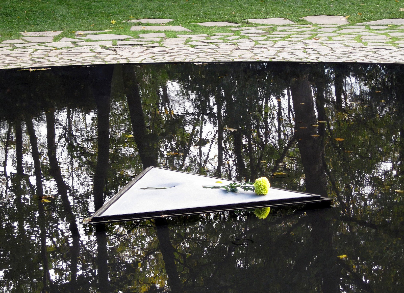 The triangular platform in the pool of the Memorial to the Sinti and Roma of Europe Murdered under National Socialism.