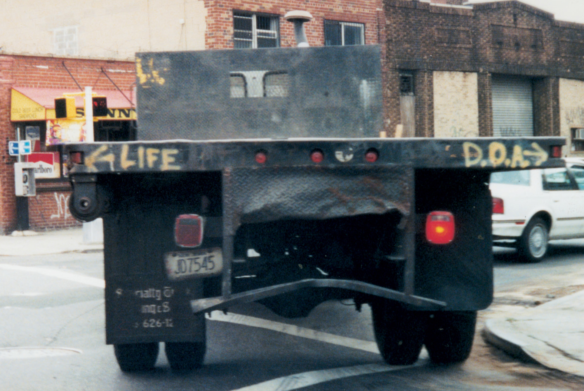 A photo by Joseph Fratesi of the back of a truck with the word 