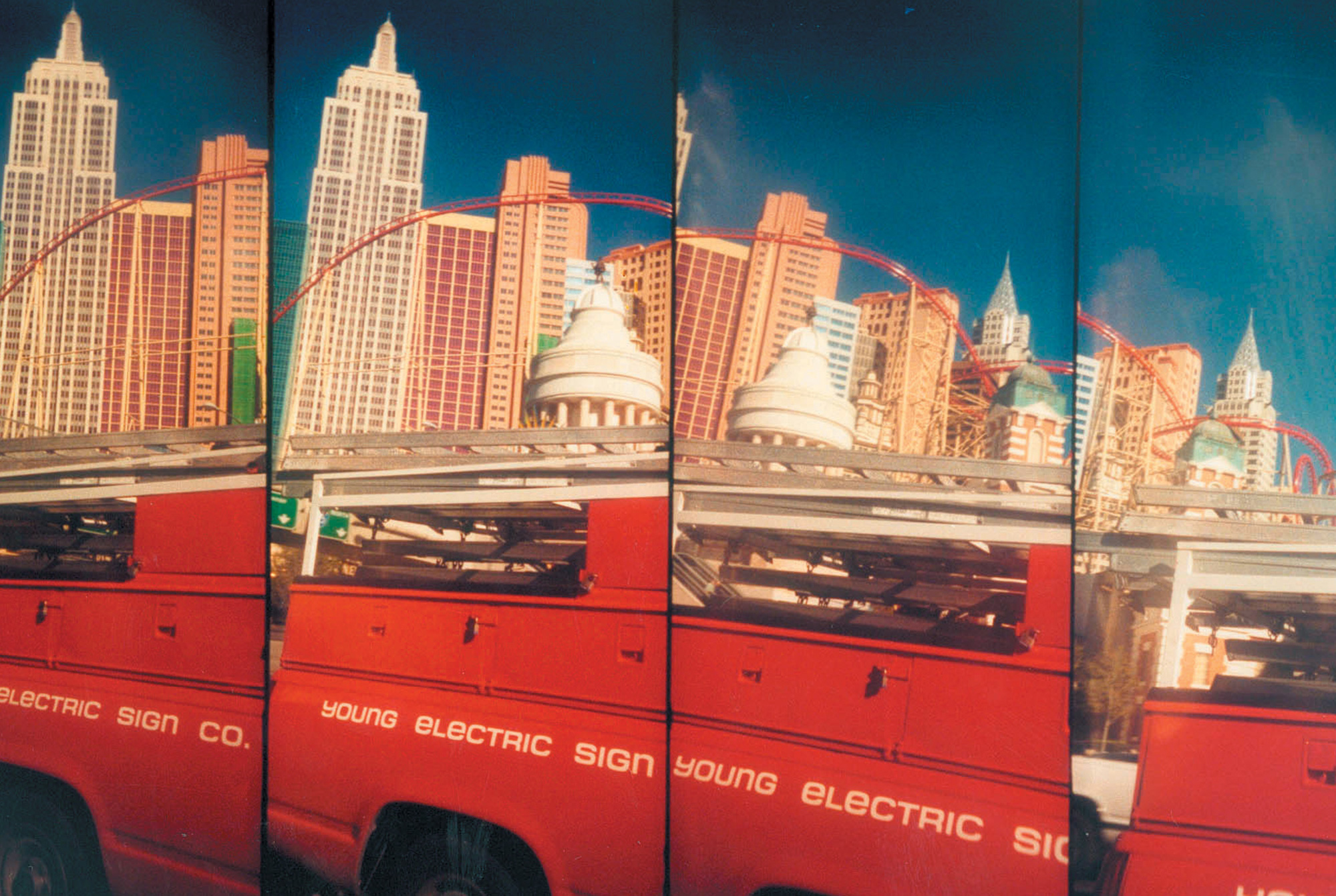 Four Lomographic images depicting a red truck in front of tall buildings in a city.