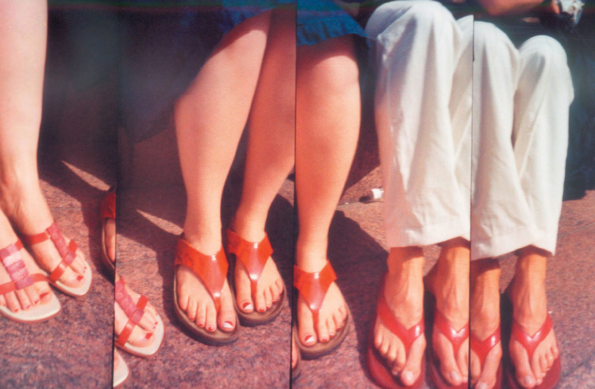 Four Lomographic images depicting women's feet in sandals.