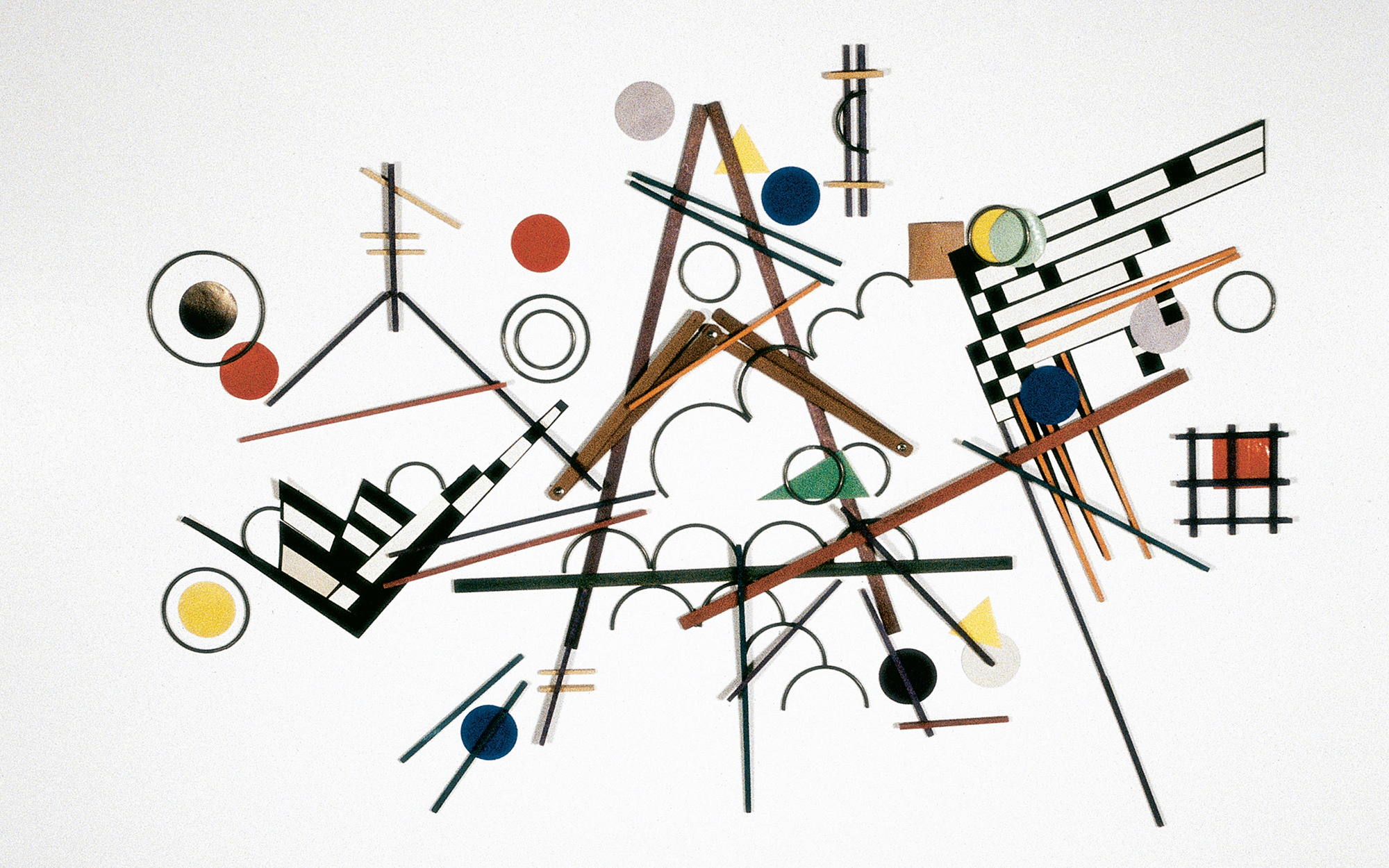 A photograph of a faithful recreation of Vasily Kandinsky’s 1923 painting entitled Composition 8. The recreation was made by using only materials and methods found in Fröbel’s system, including paper parquetry, sticks, rings, weaving, slats, and jointed slats.
